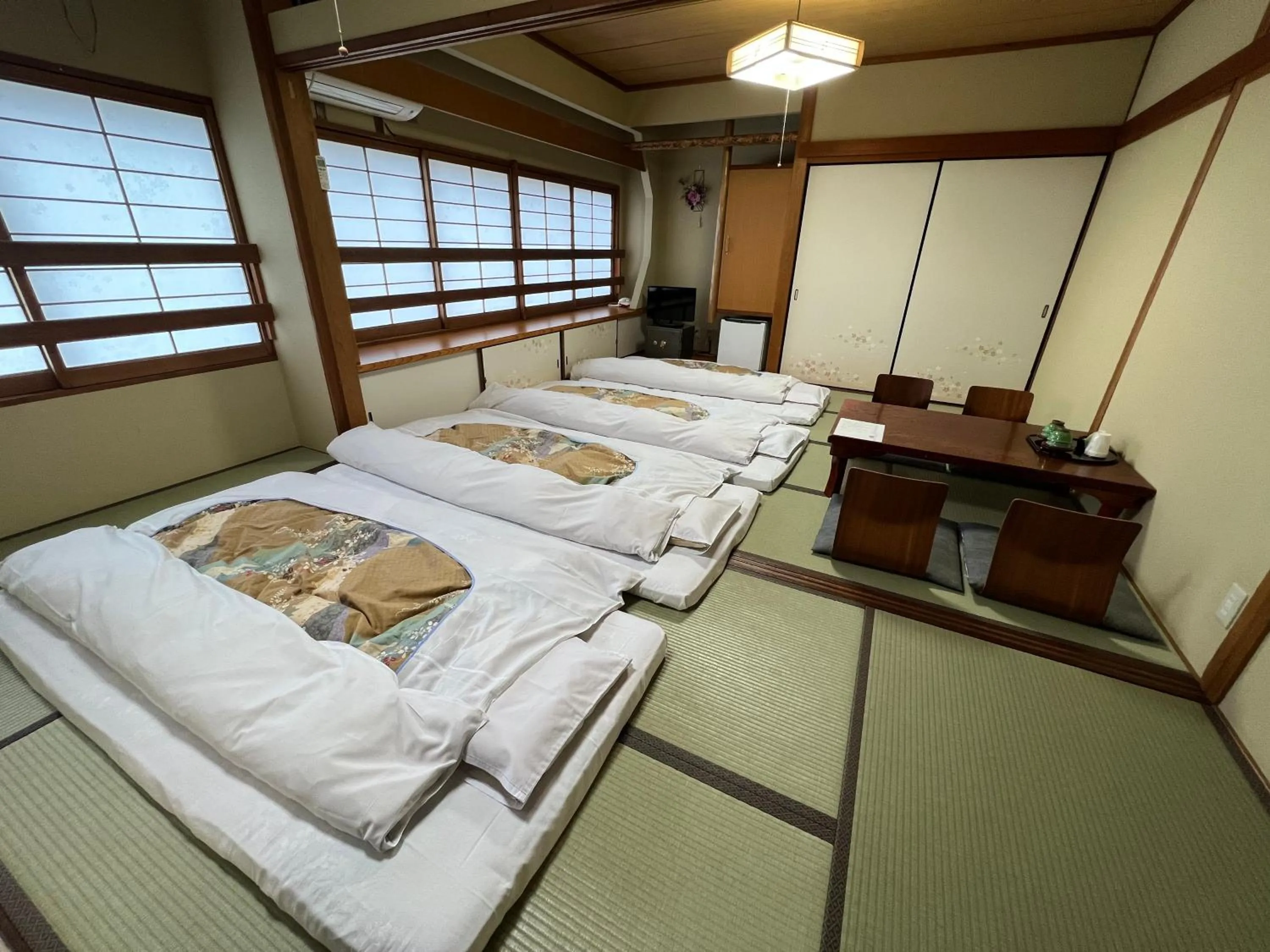 Bed in Ryokan Kousen Kazeya Group