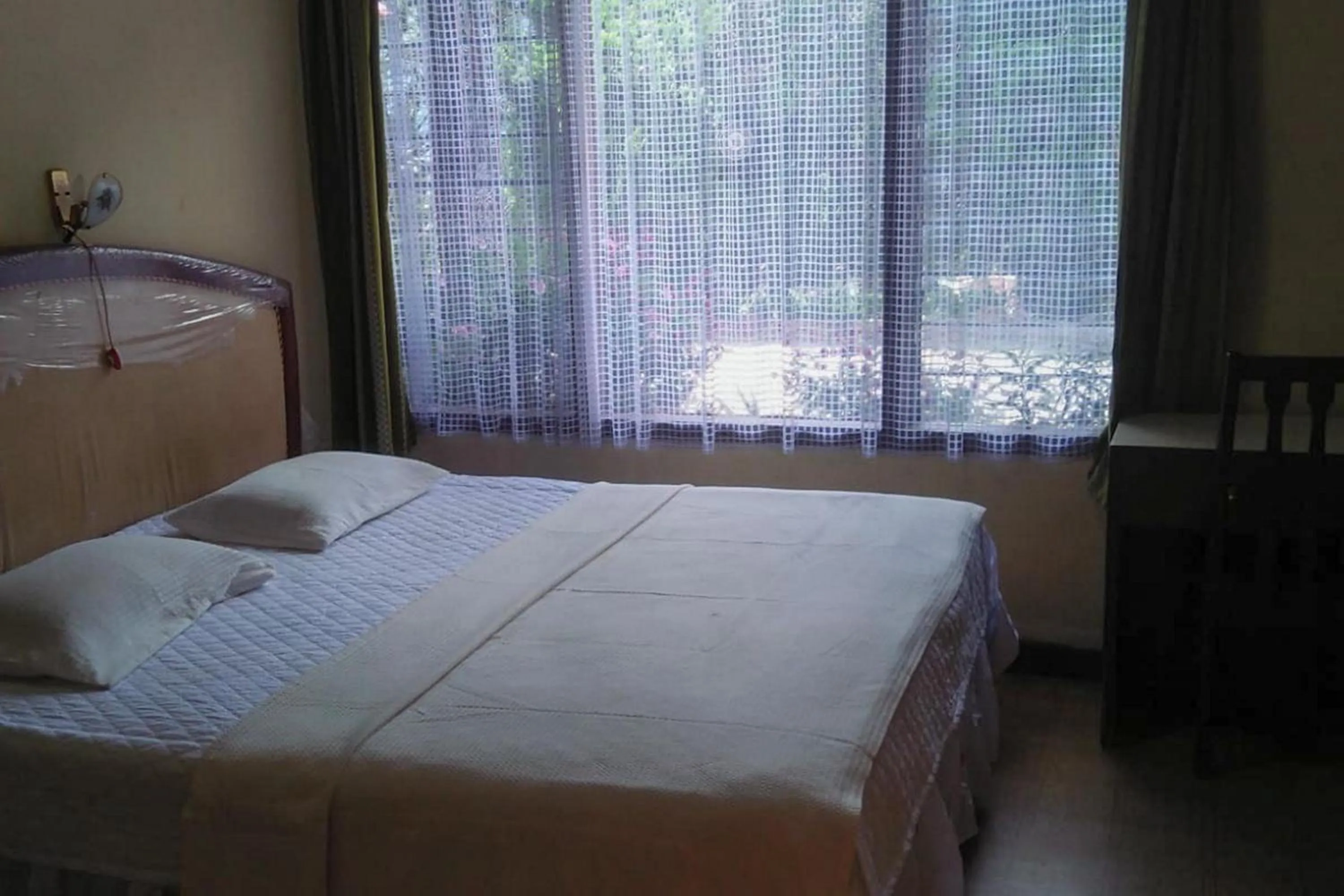 Bed in Hotel Olibert Parapat Ajibata Mitra RedDoorz