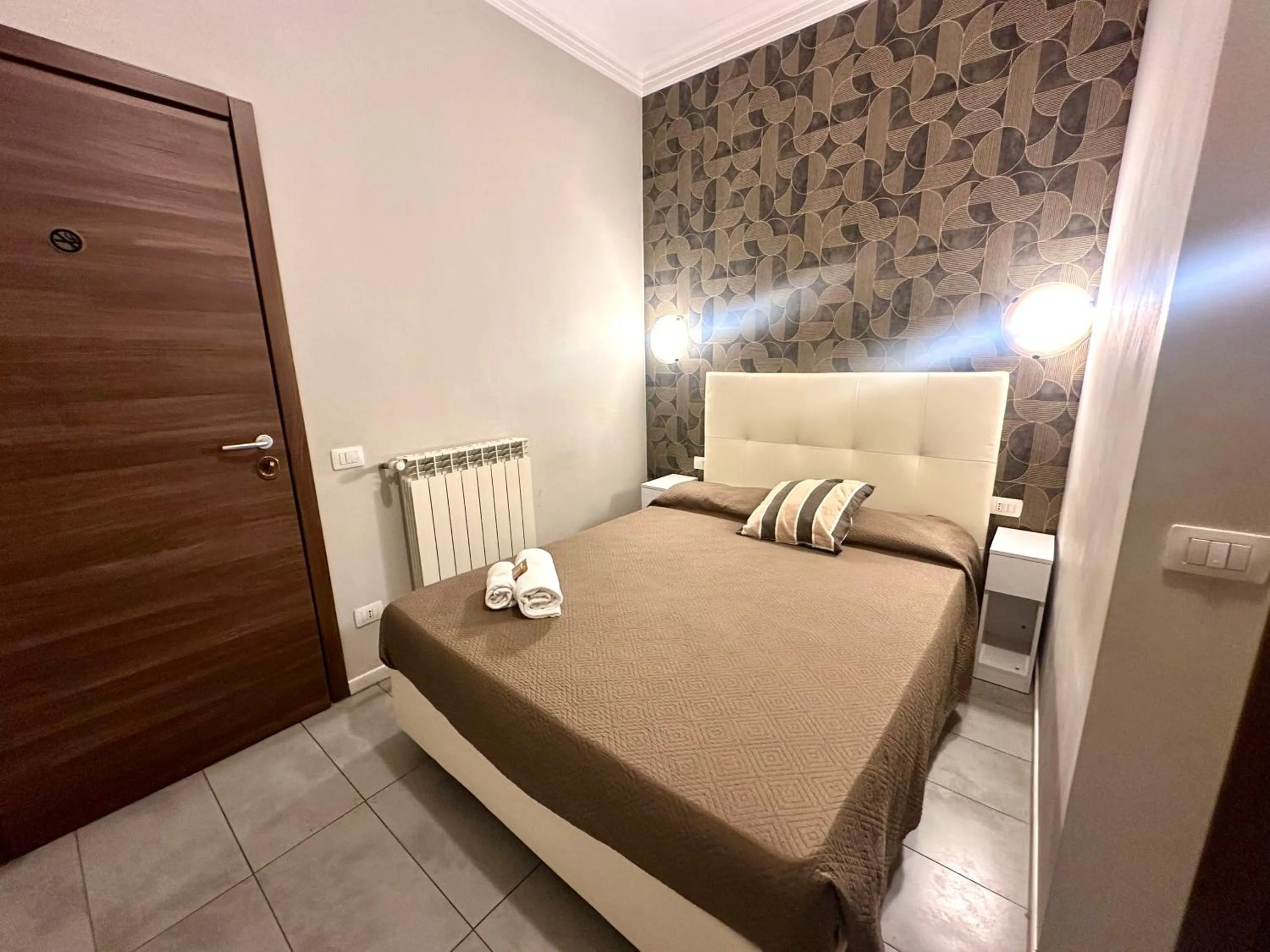 Bed in Golden Milano Hotel