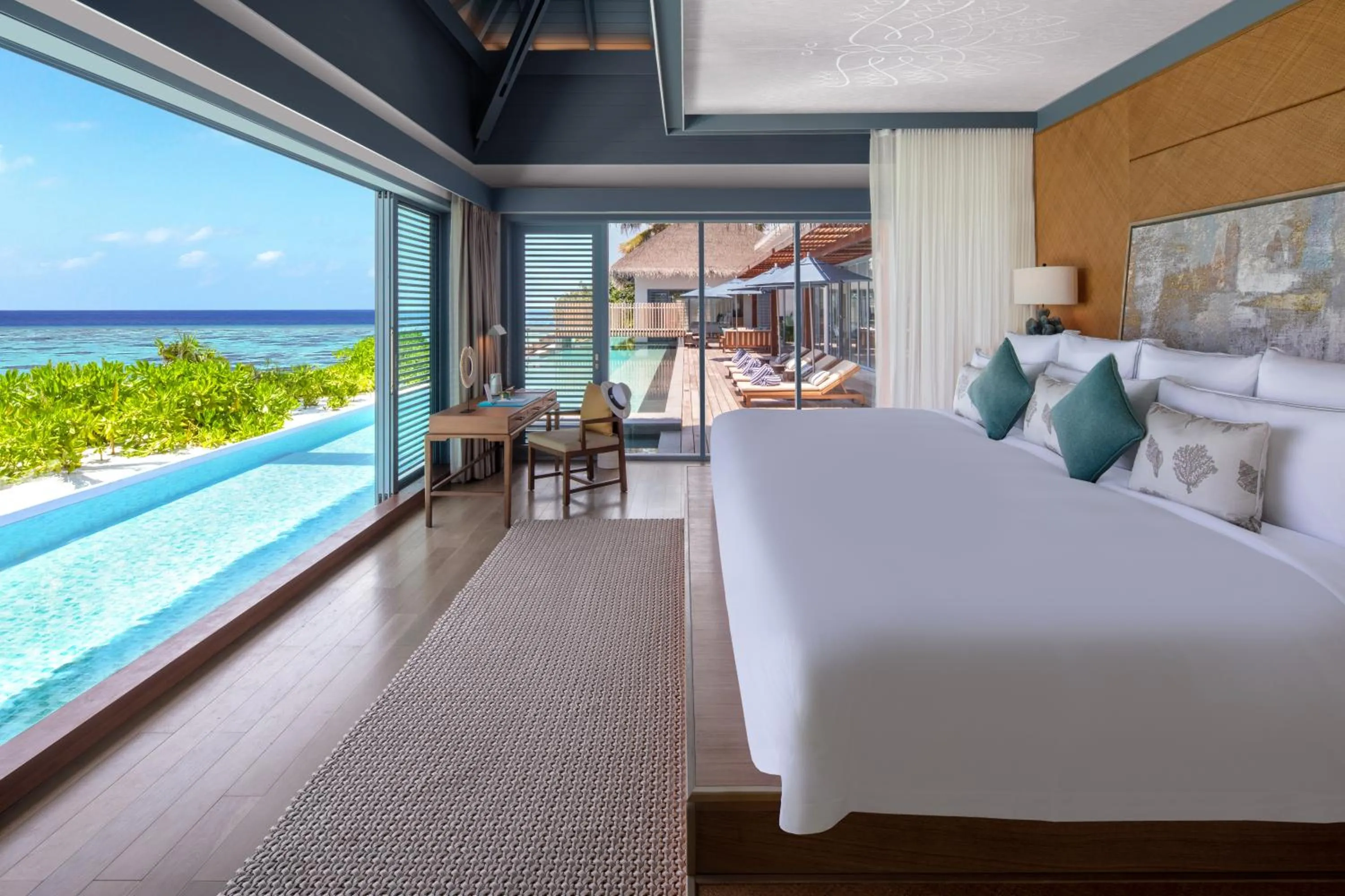 Bed in Raffles Maldives Meradhoo
