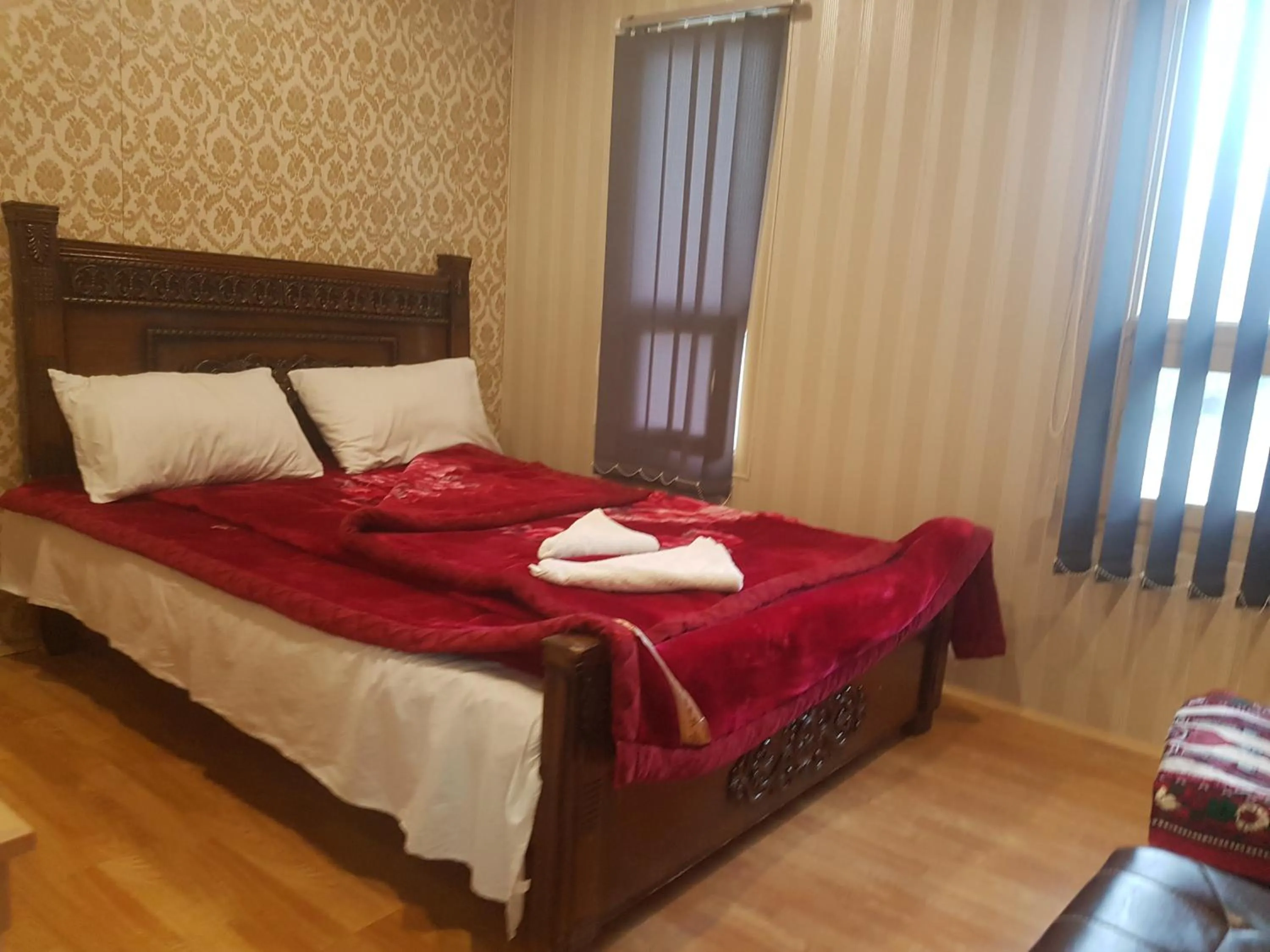 Bed in Khunjerab Hotel Sost