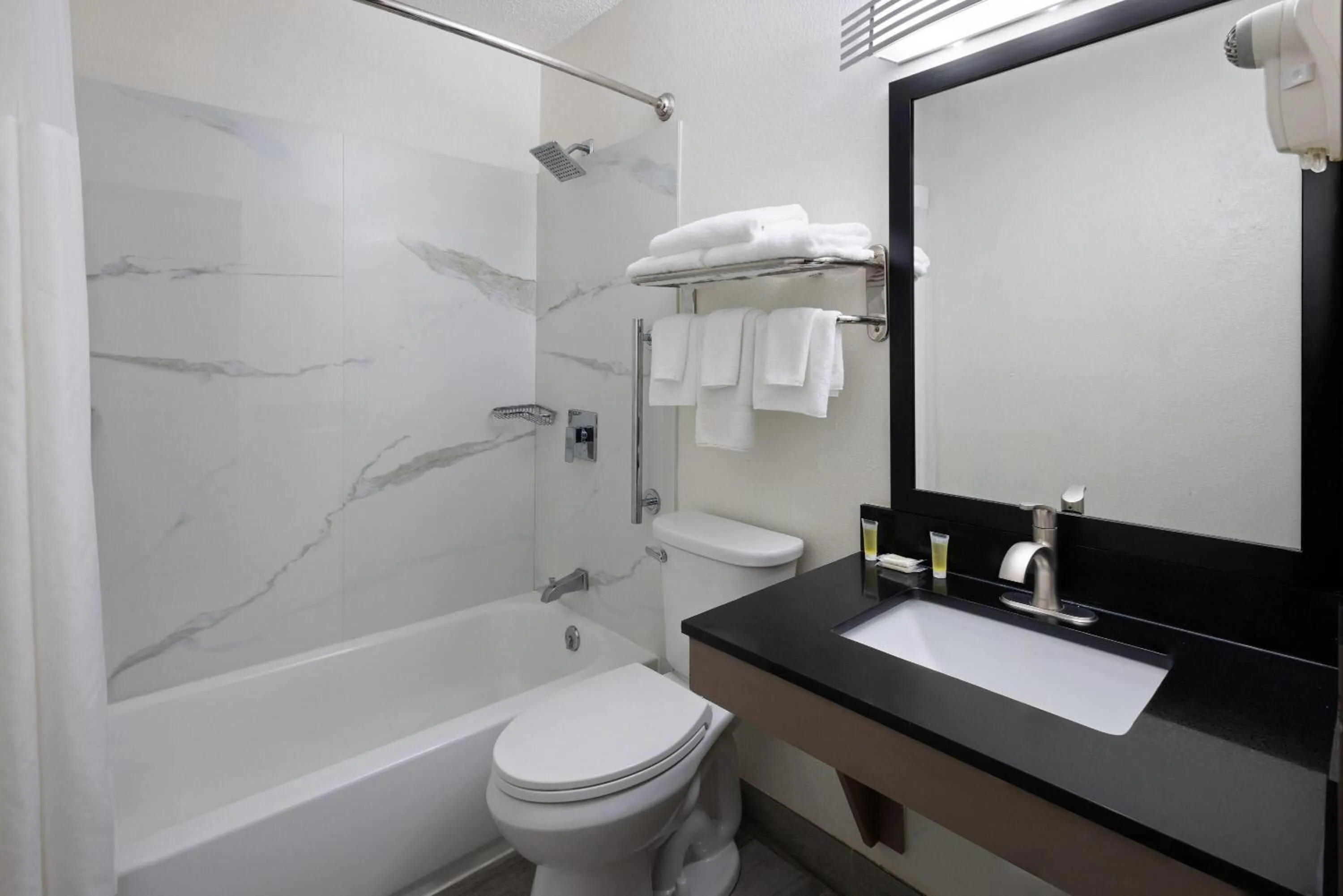 Bathroom in Super 8 by Wyndham Richmond Midlothian Turnpike