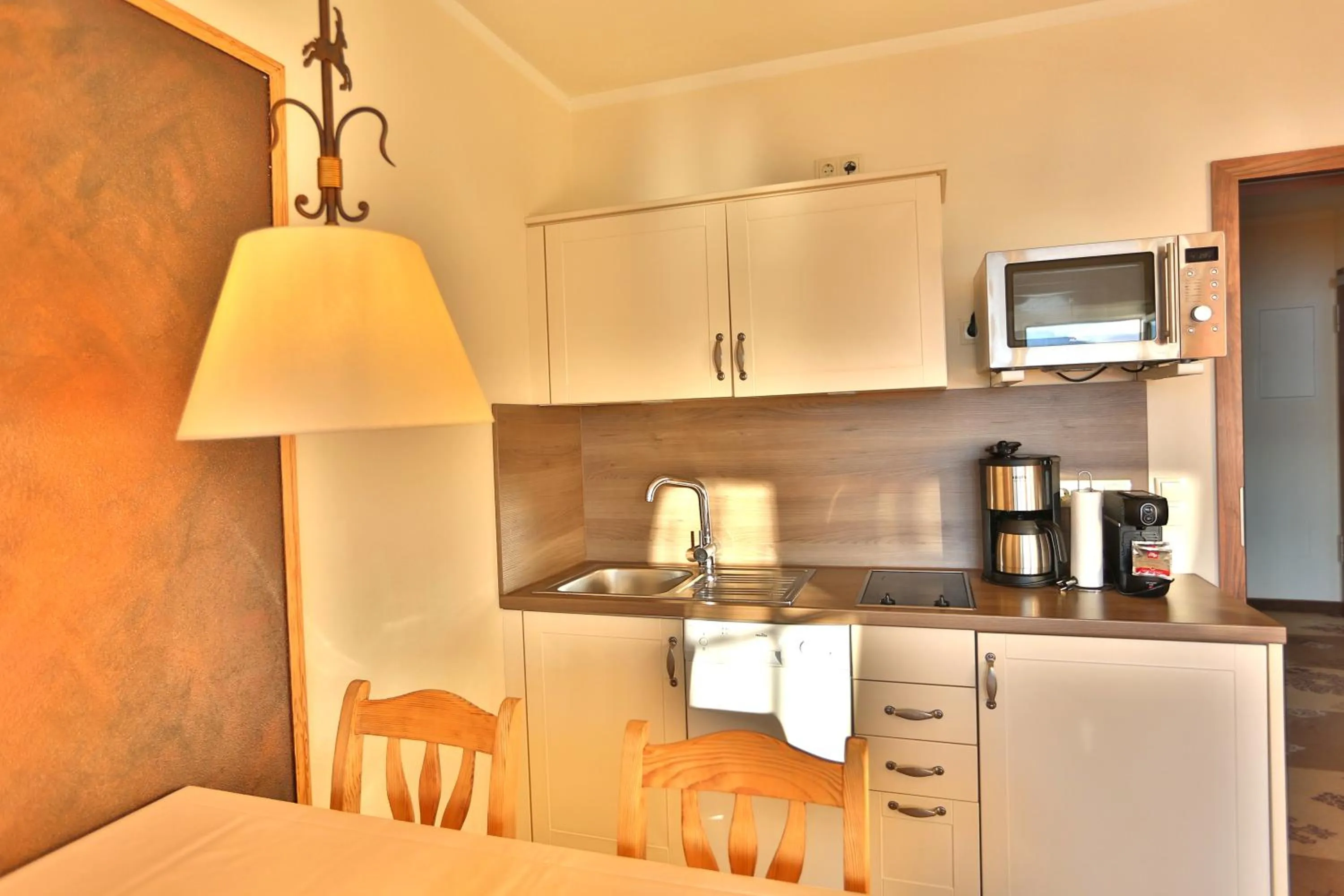 Kitchen or kitchenette in Seehotel Hartung & Ferienappartements