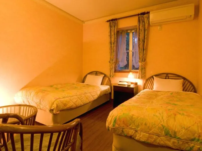 Photo of the whole room, Bed in Petit Resort Hotel Alcyon