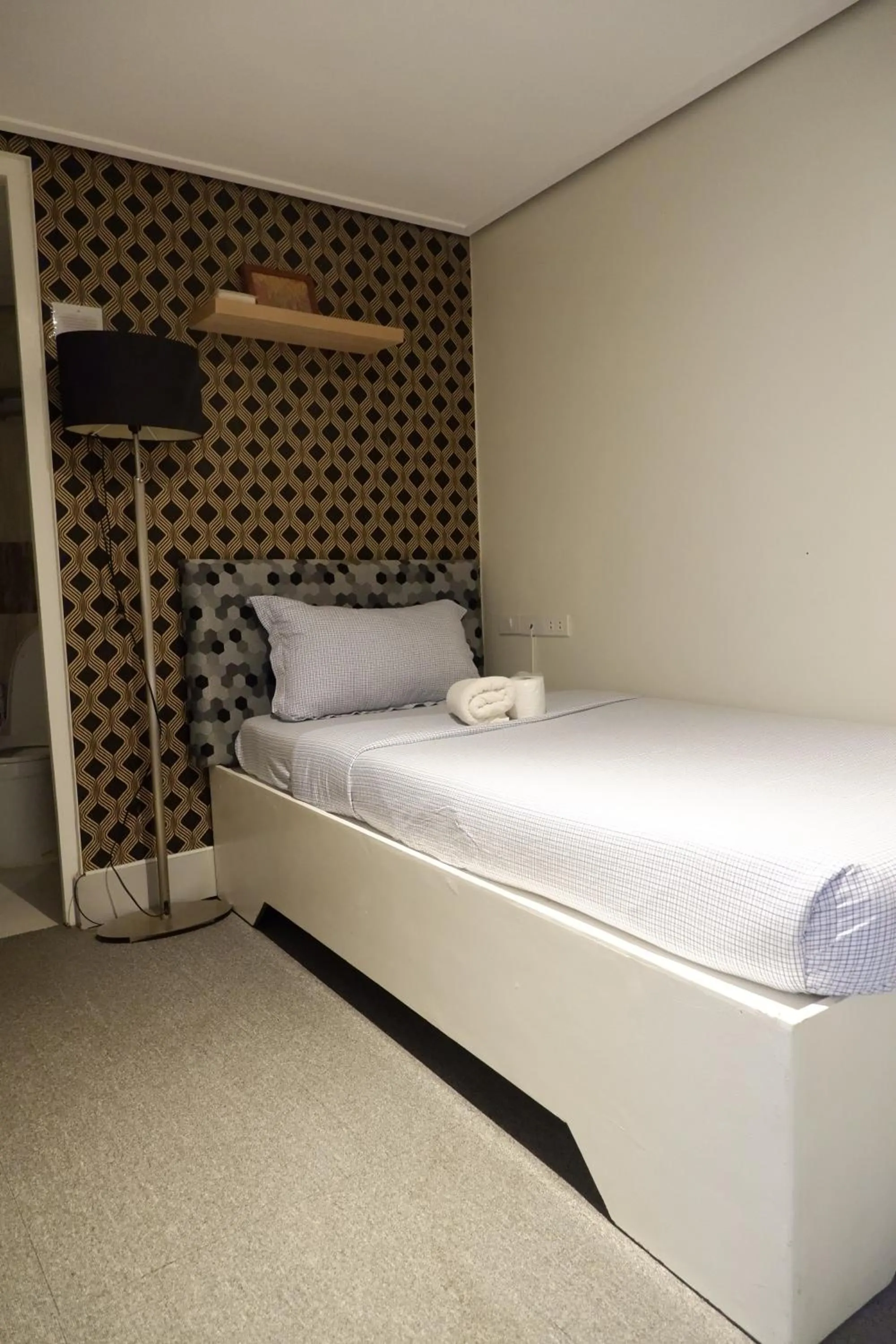 Bed in Sunset View Ridge Residences