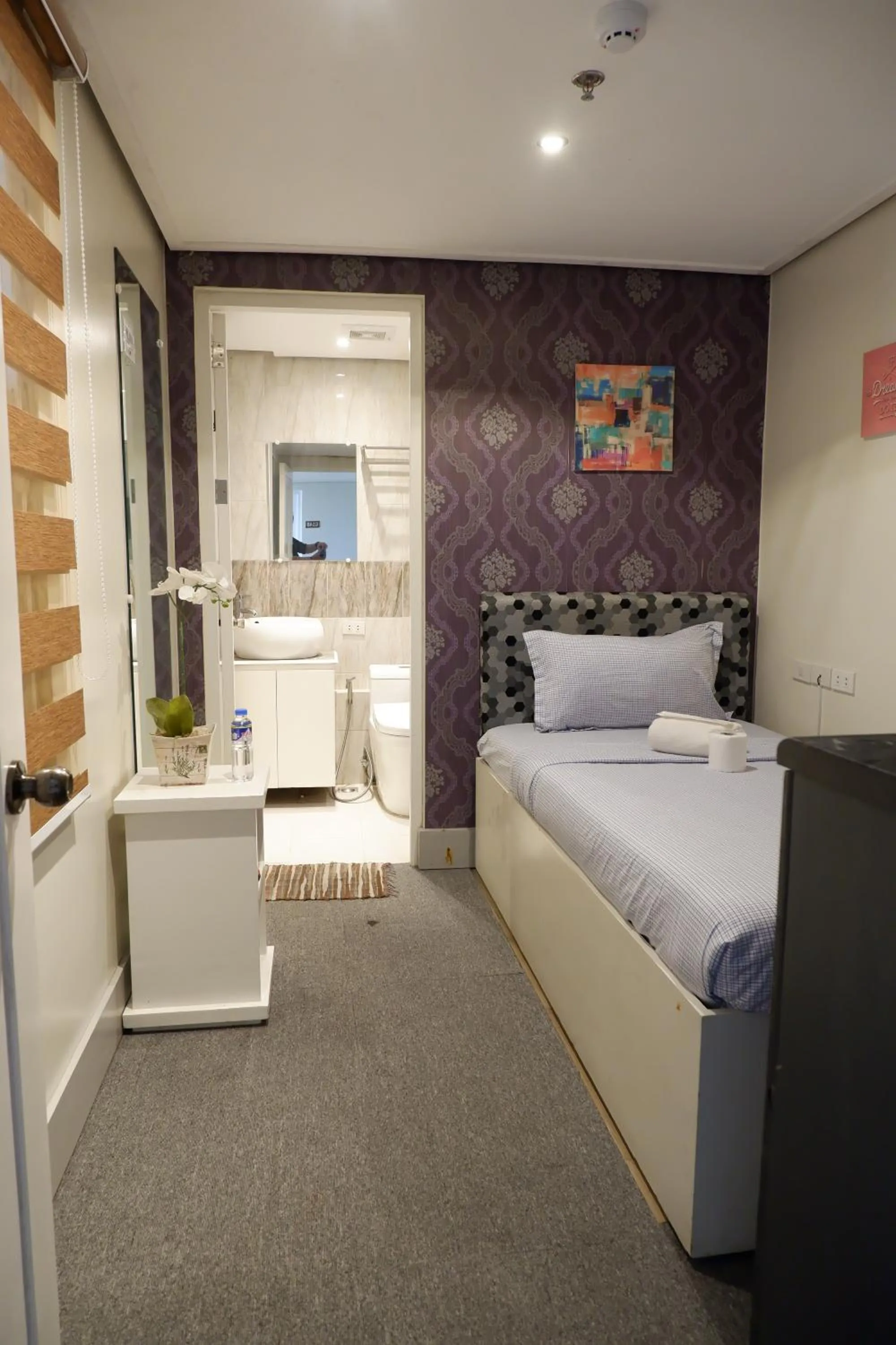 Bed in Sunset View Ridge Residences