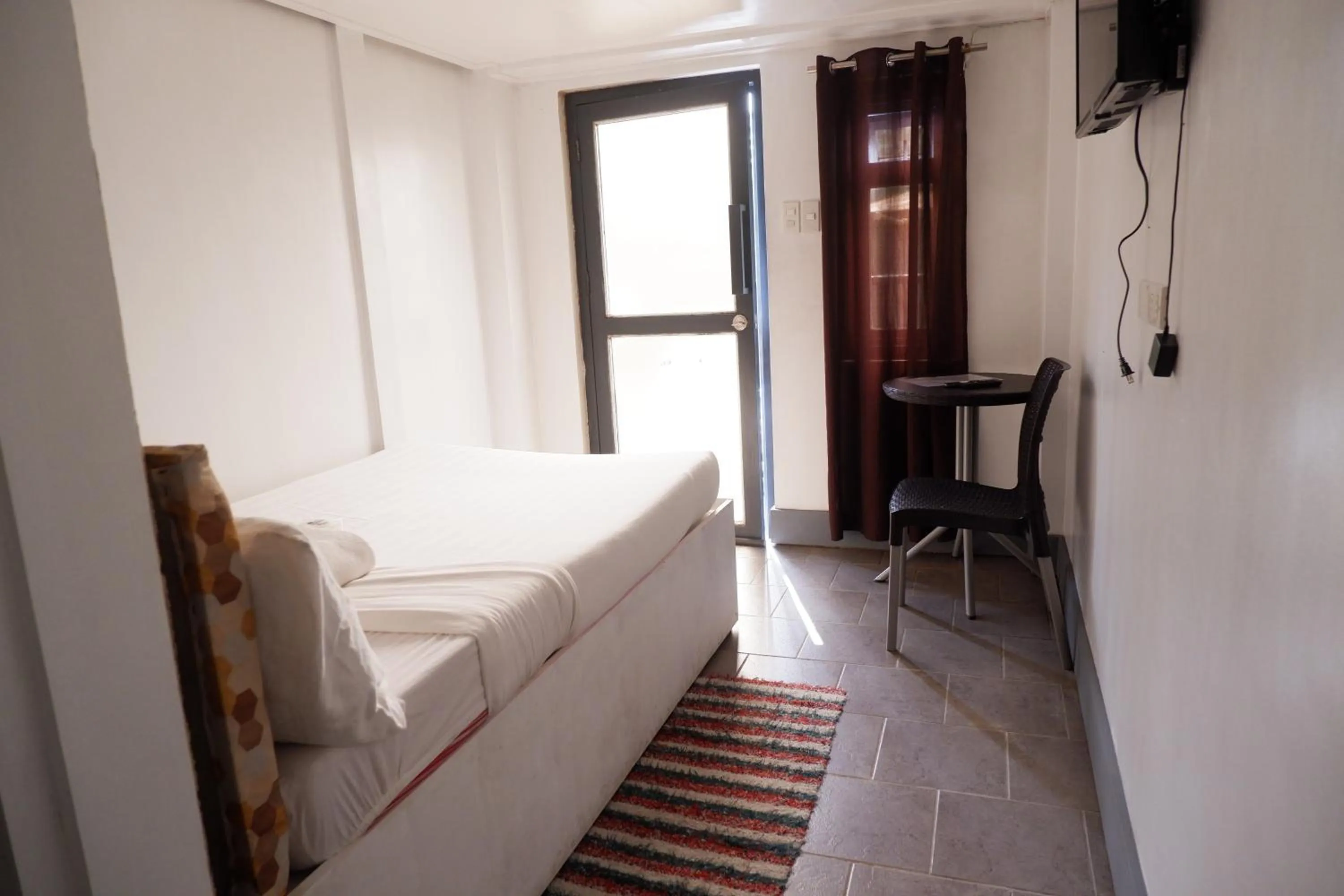 Bed in Sunset View Ridge Residences