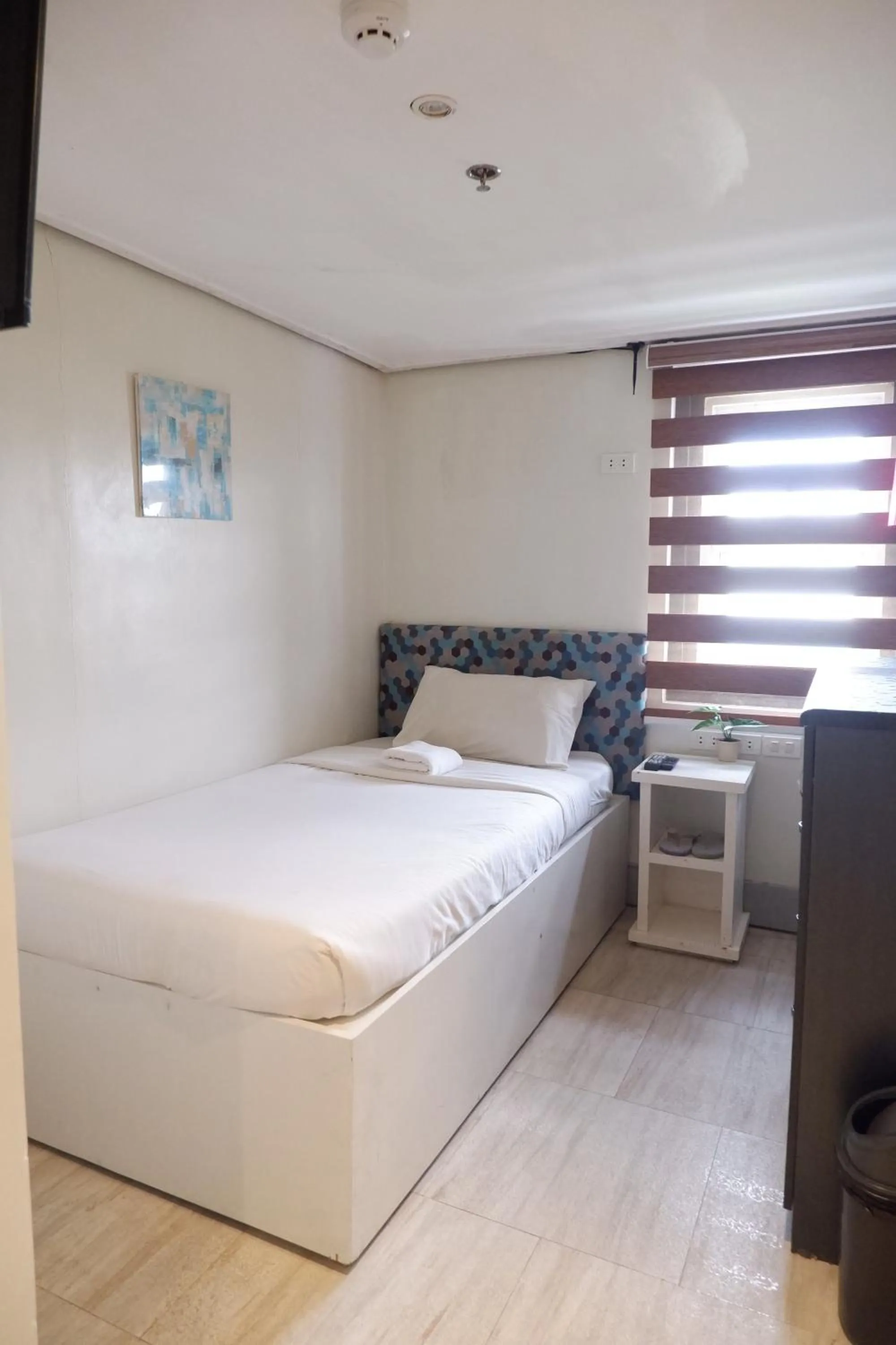 Bed in Sunset View Ridge Residences