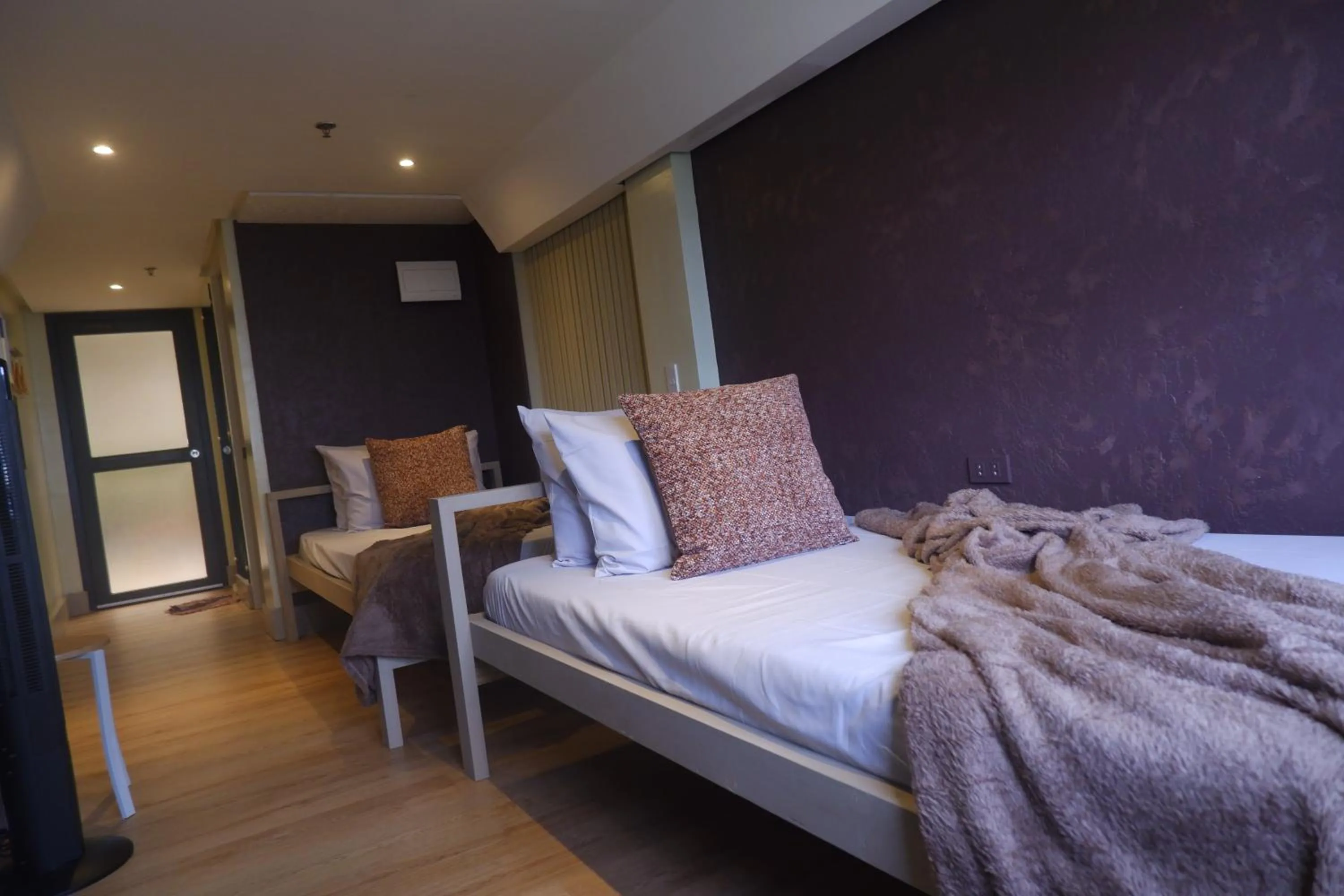 Bed in Sunset View Ridge Residences