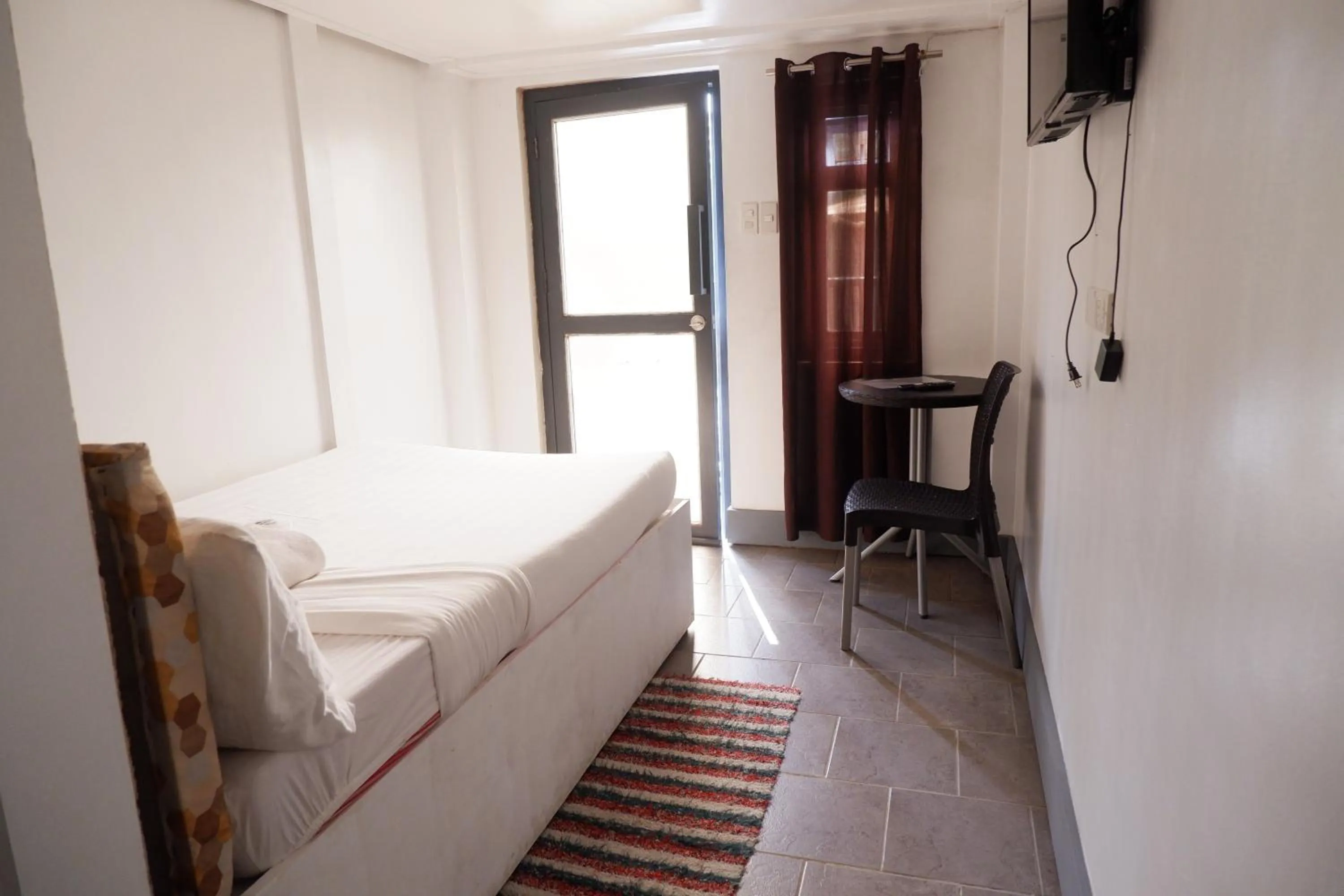 Bed in Sunset View Ridge Residences