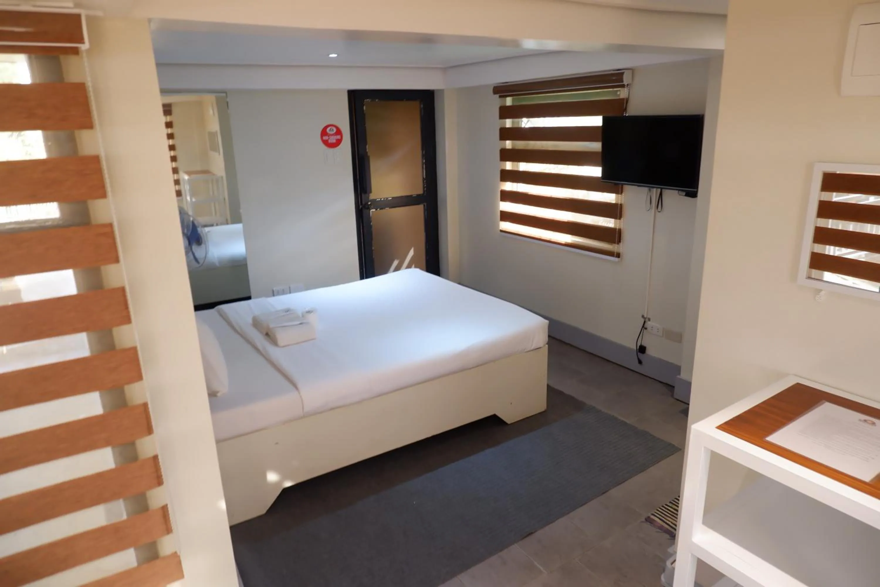 Bed in Sunset View Ridge Residences