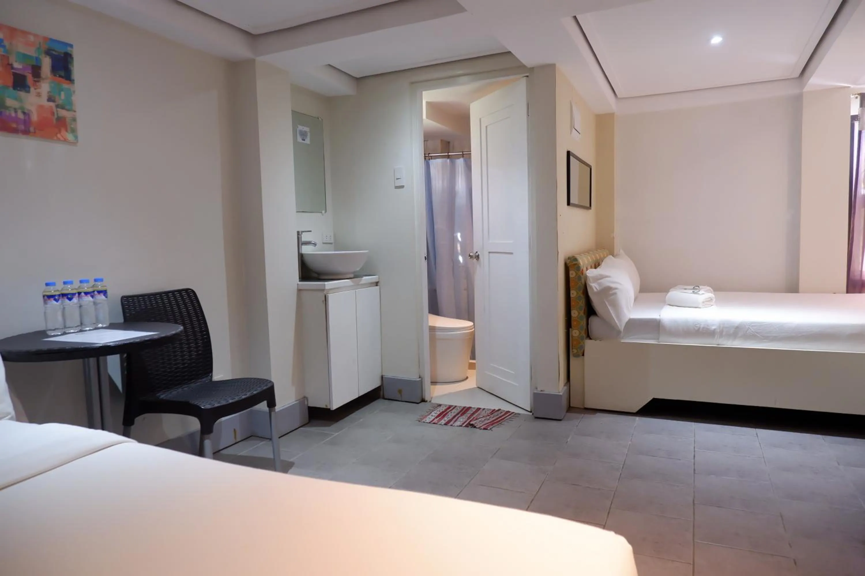 Bed in Sunset View Ridge Residences