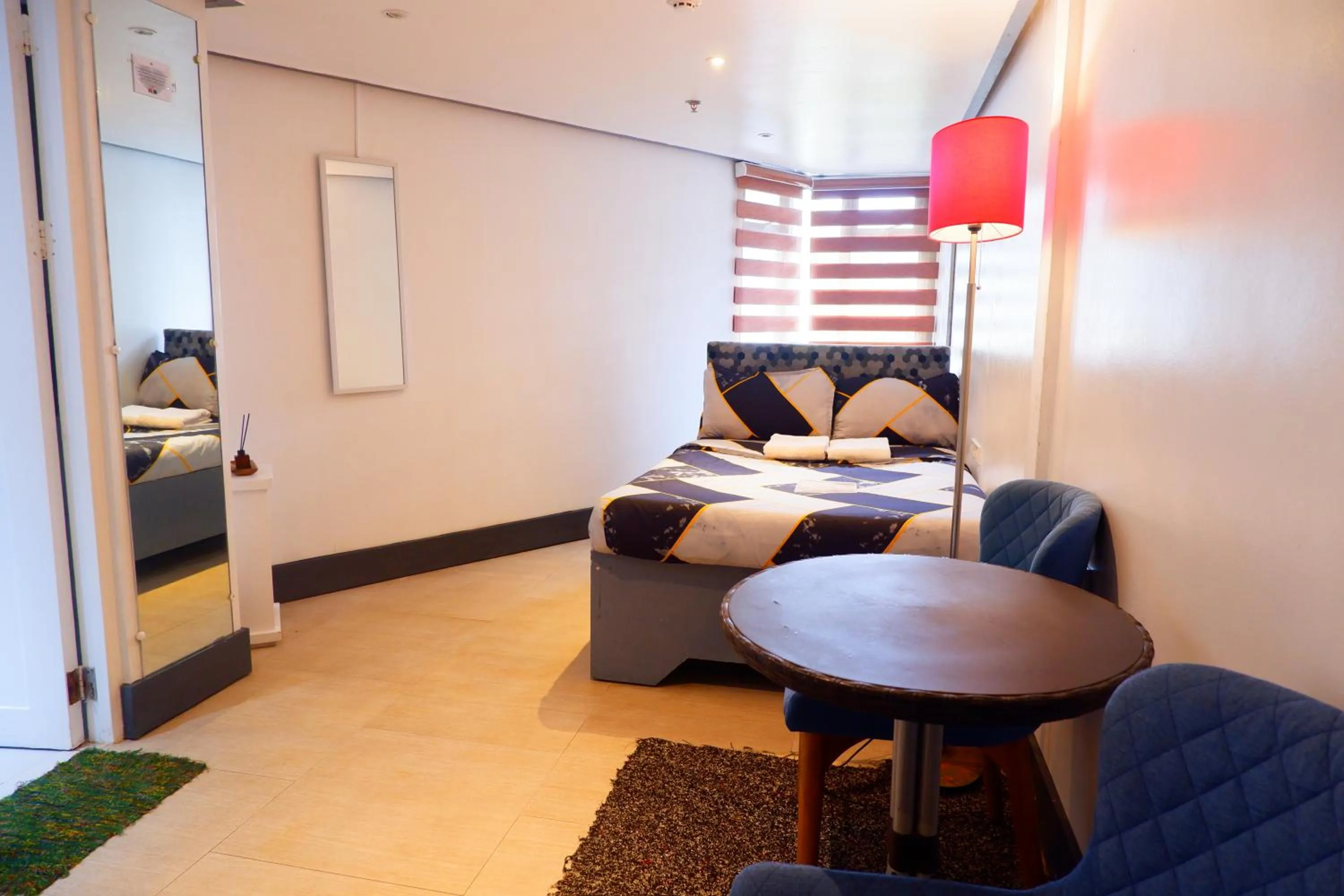 Bed in Sunset View Ridge Residences