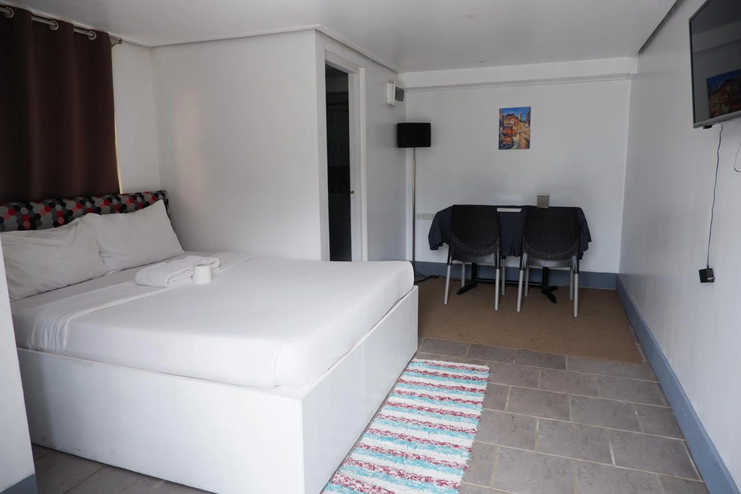 Bed in Sunset View Ridge Residences