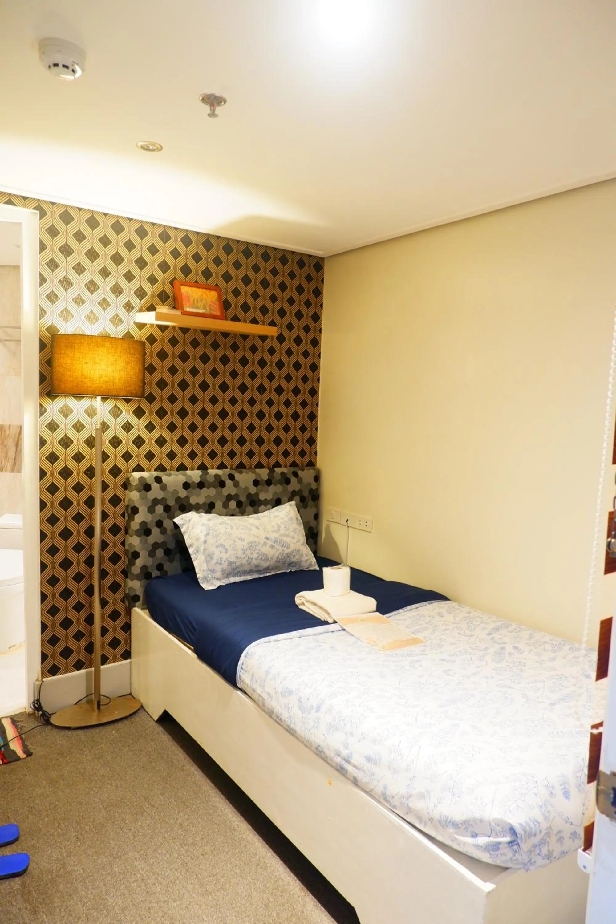 Bed in Sunset View Ridge Residences