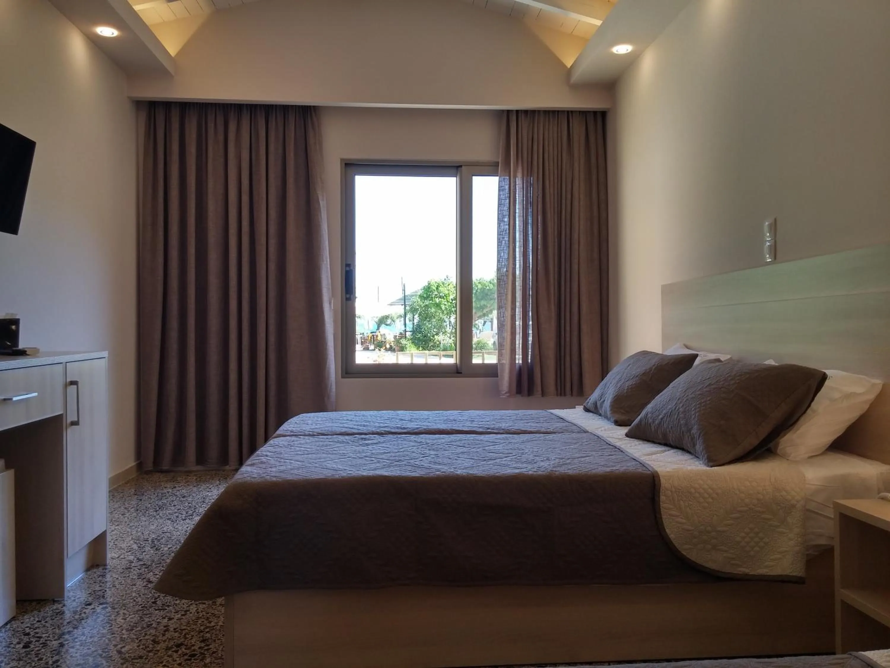 Bed in Anetis Beach Hotel