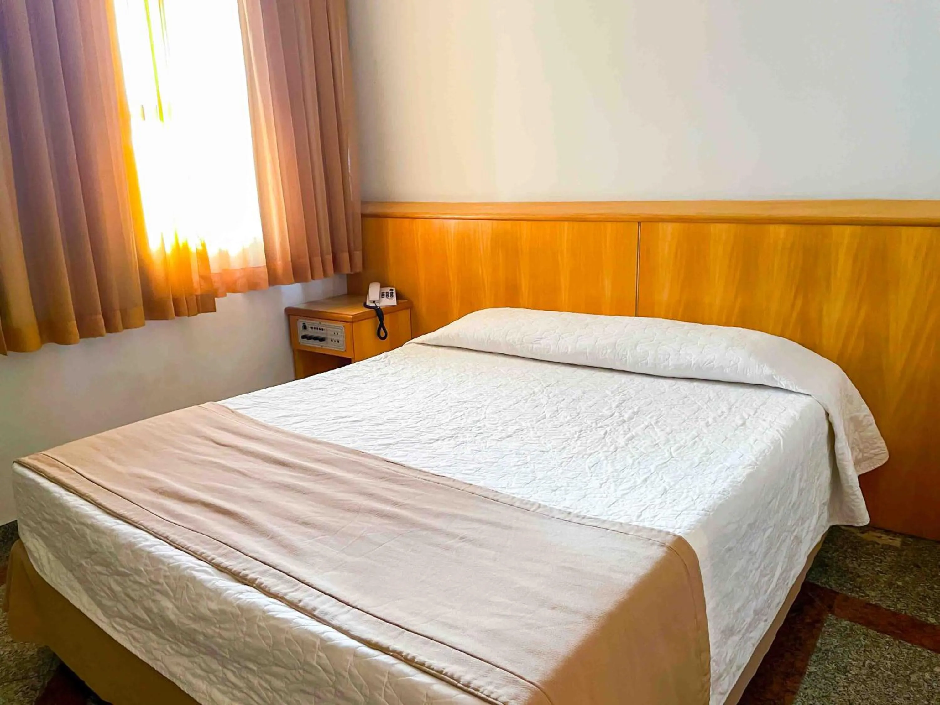 Bed in Saionara Hotel