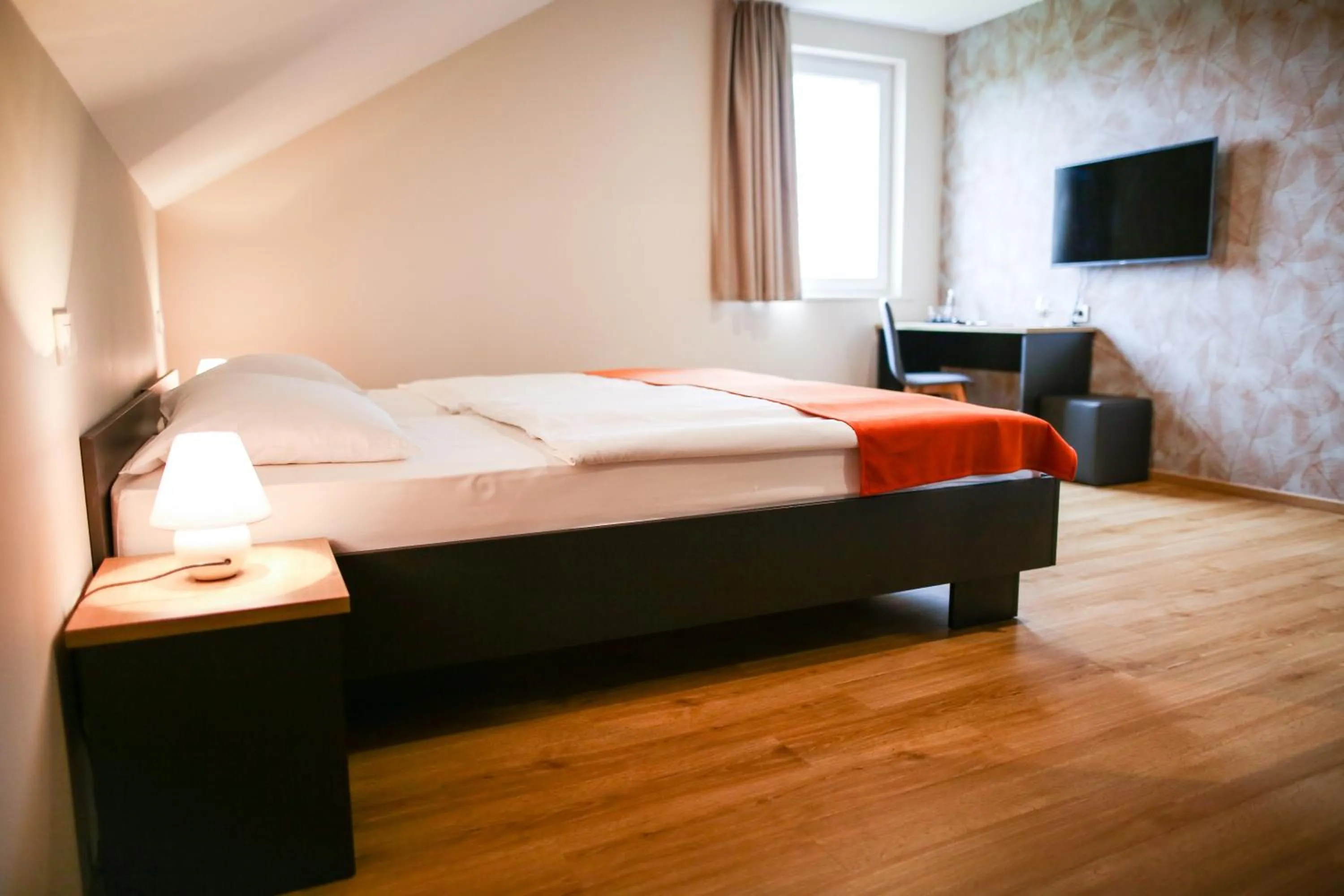 Bed in Ambient Hotel