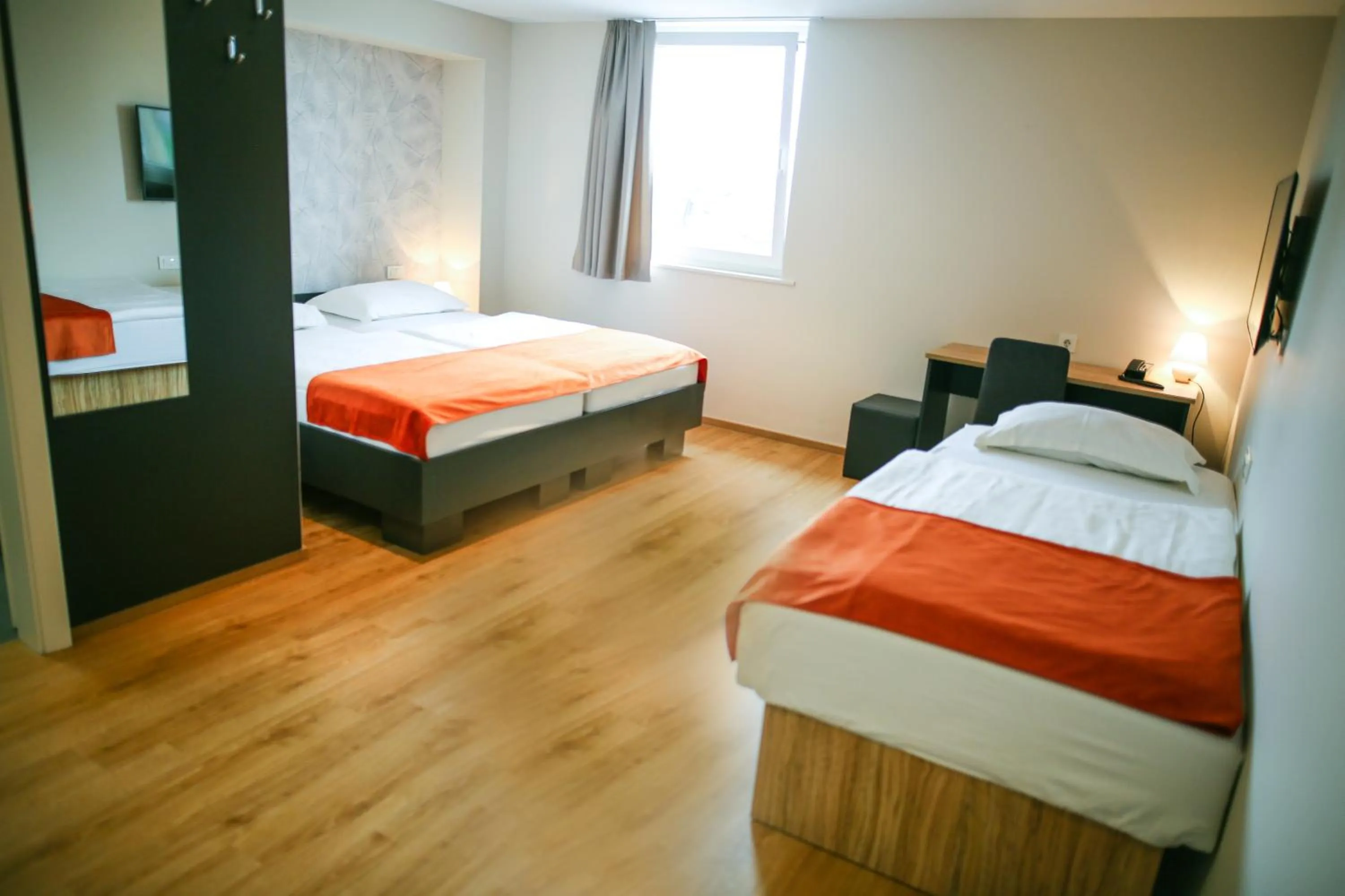 Bed in Ambient Hotel