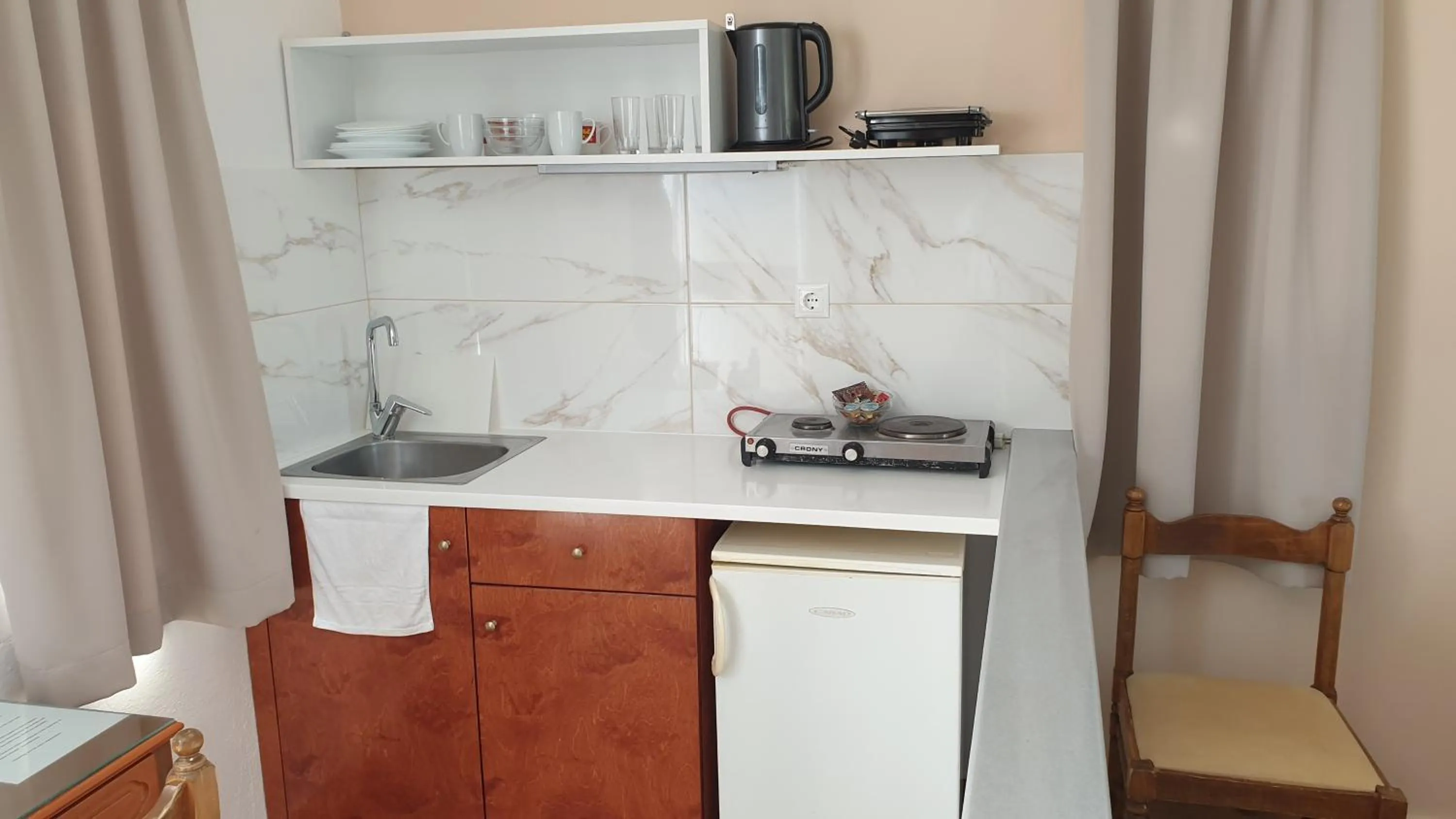 Kitchen or kitchenette in Miros Hotel Apartments