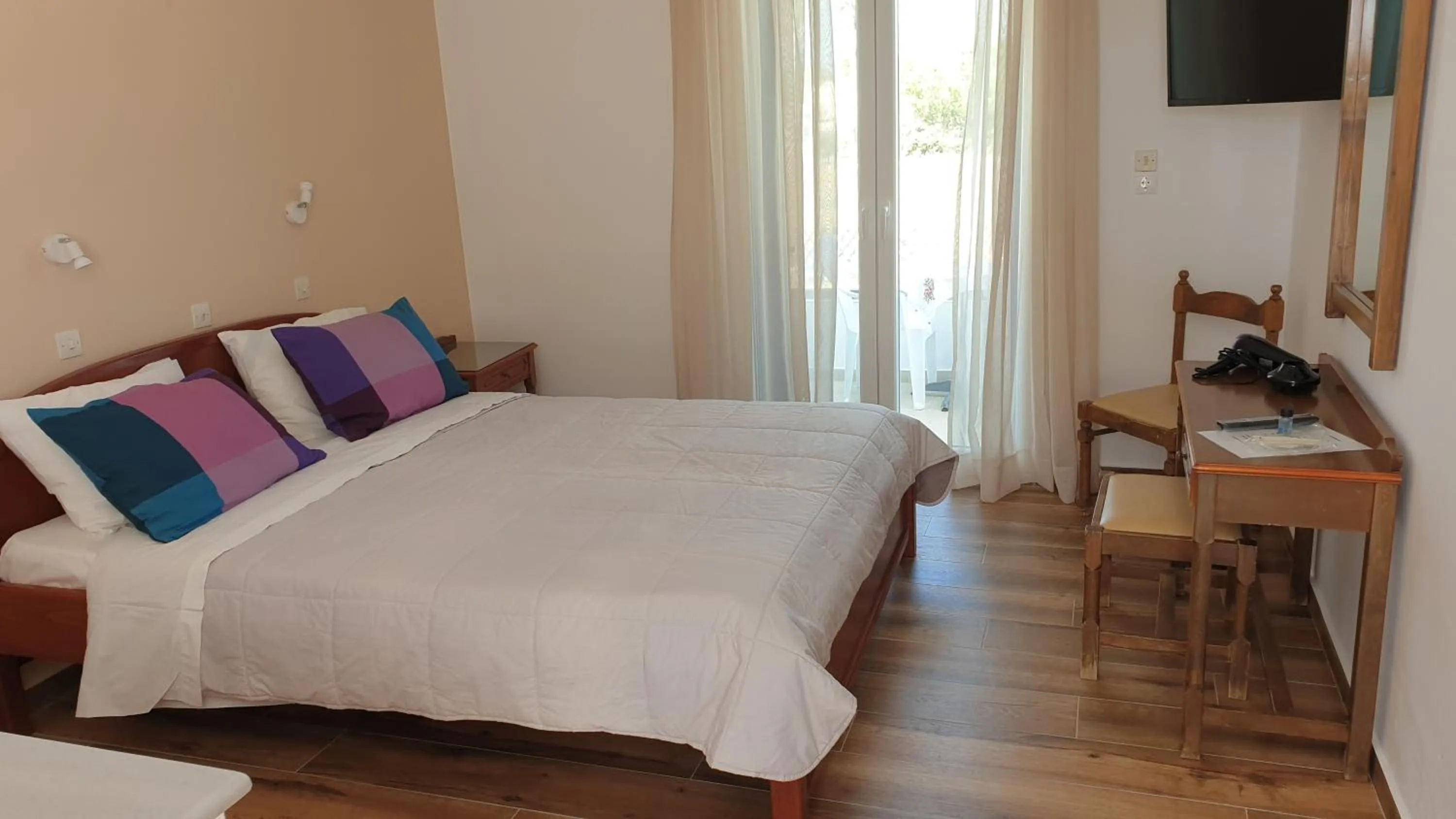 Bed in Miros Hotel Apartments