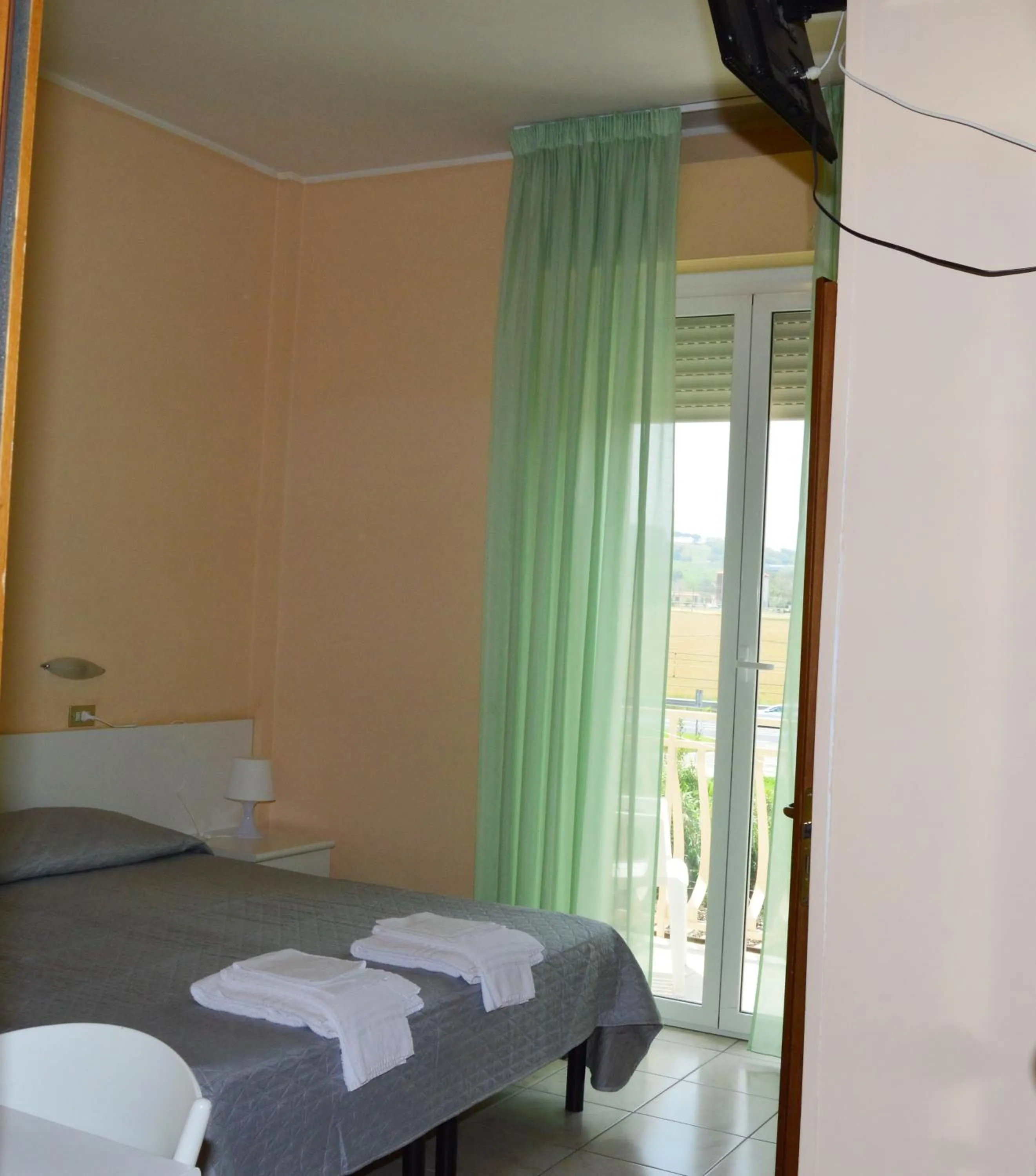 Photo of the whole room, Bed in Hotel Perla