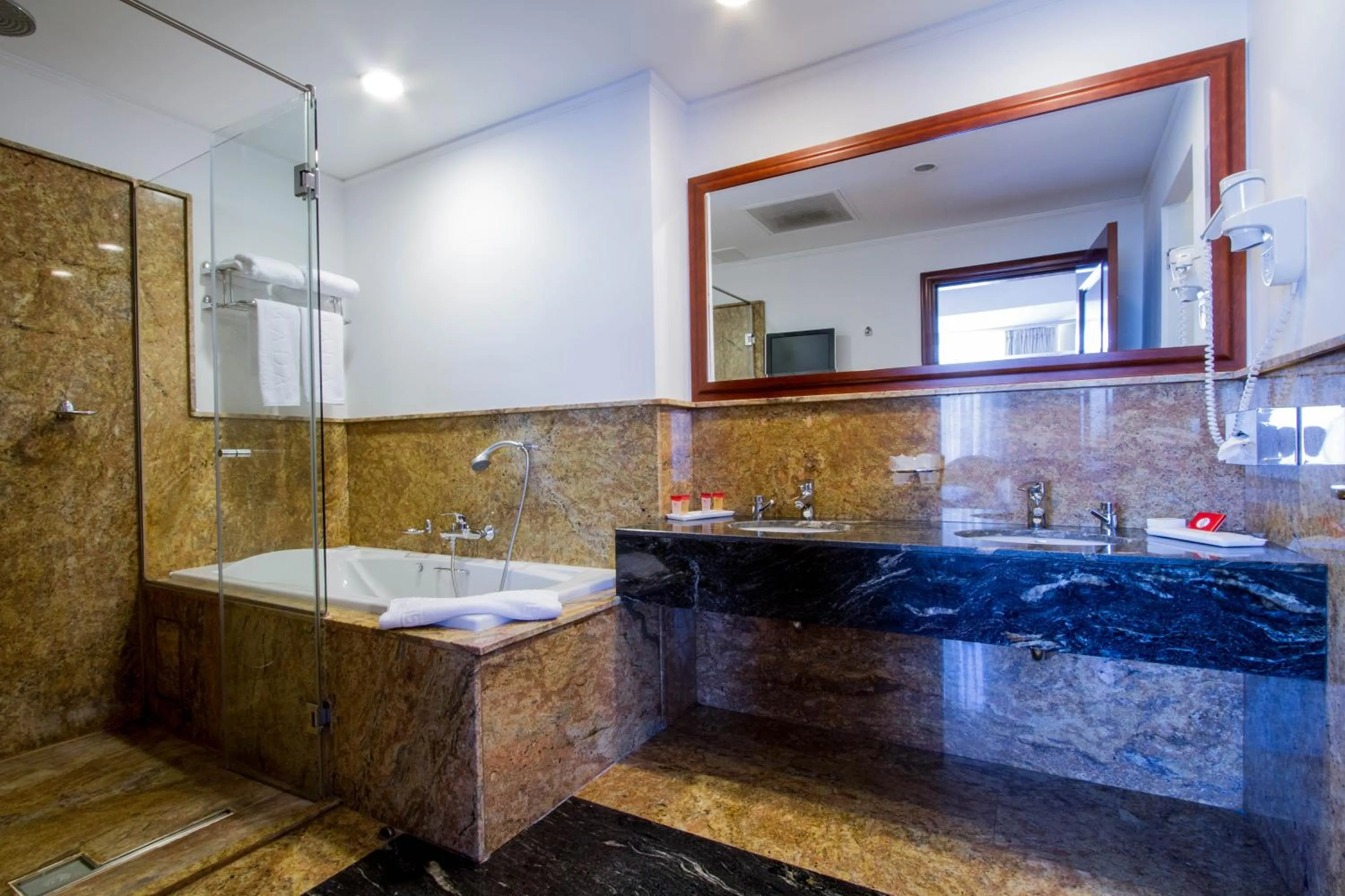 Photo of the whole room, Bathroom in Ramada by Wyndham Brasov