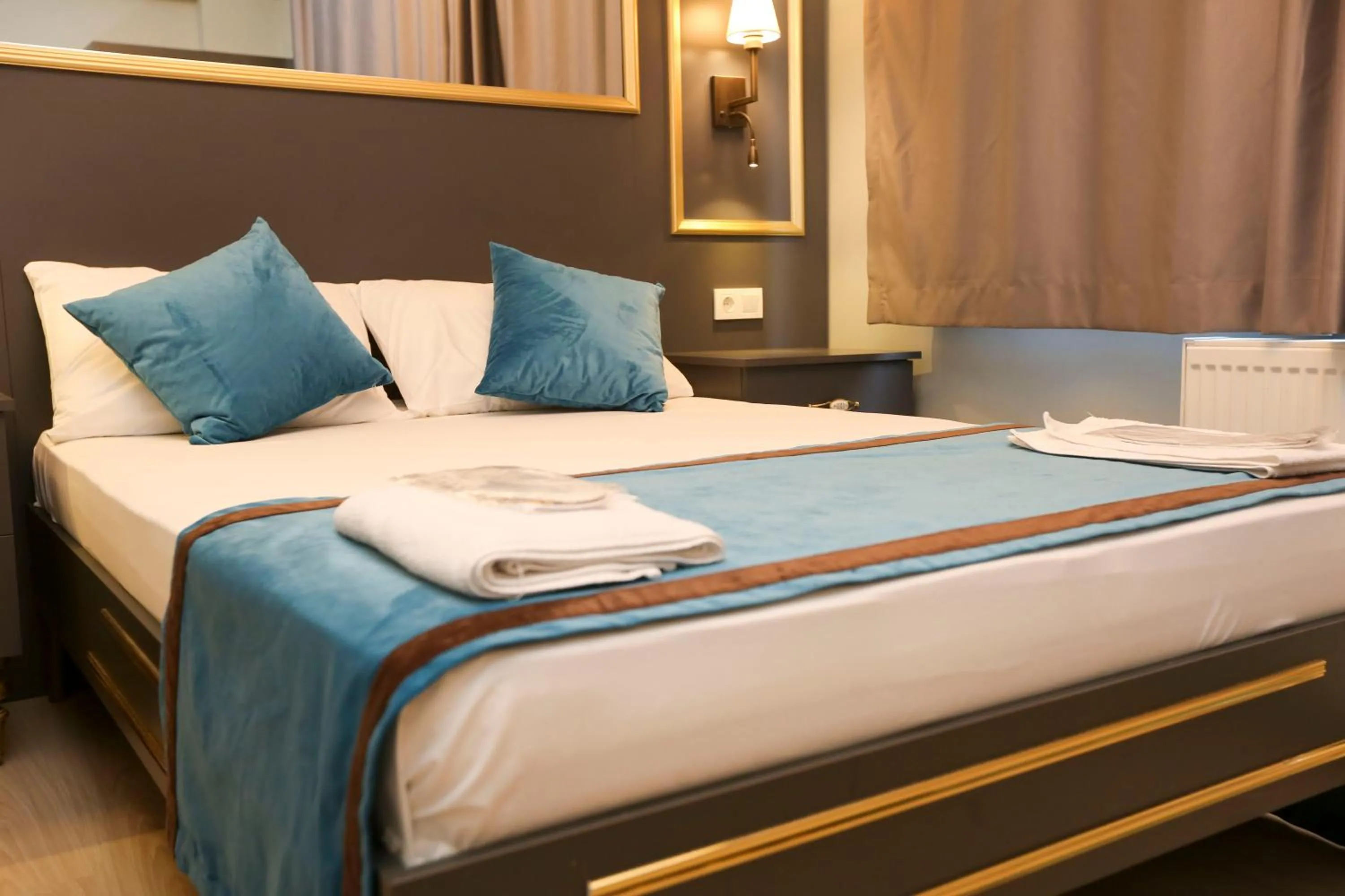 Bed in Grand Moon Hotel Suites