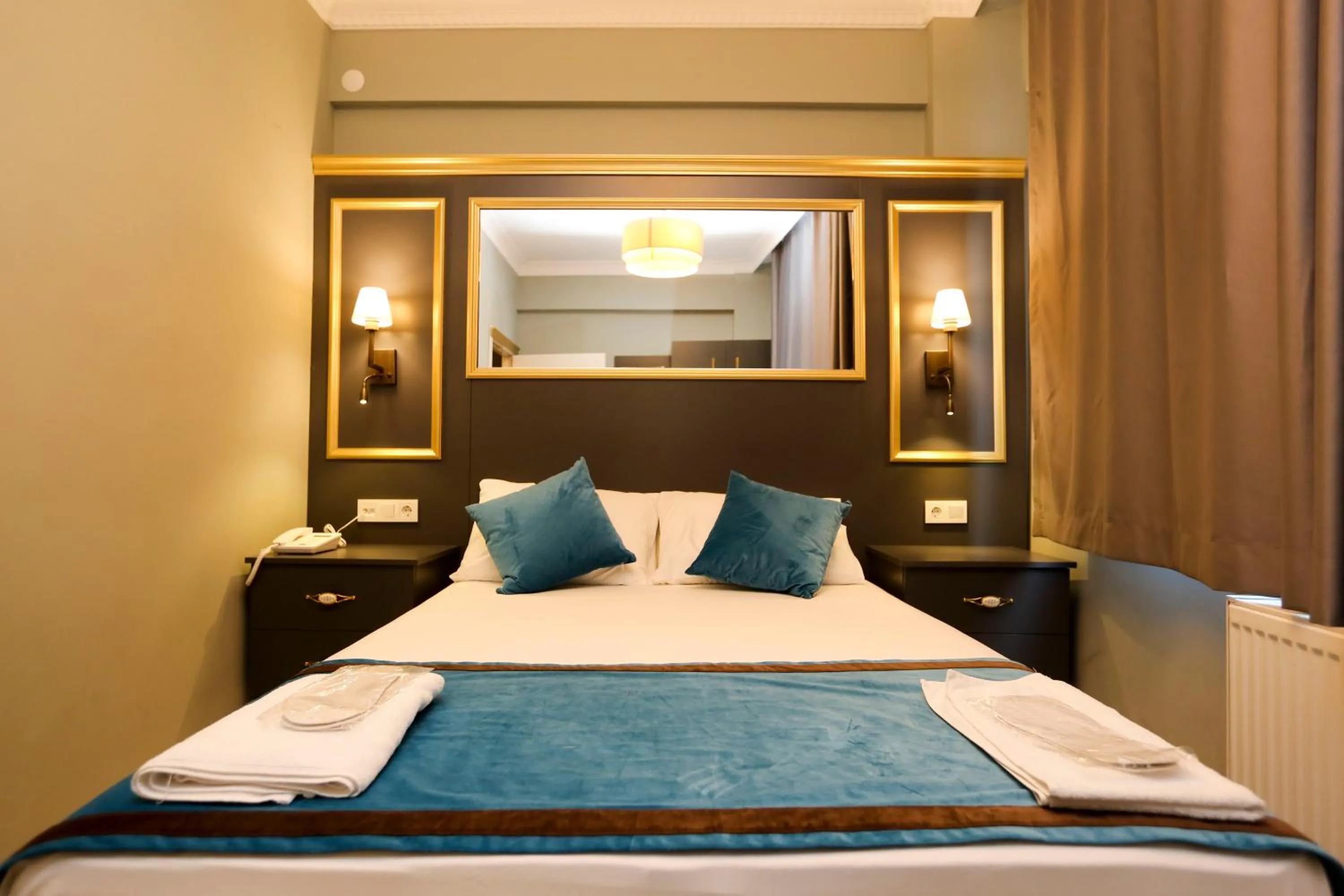 Bed in Grand Moon Hotel Suites