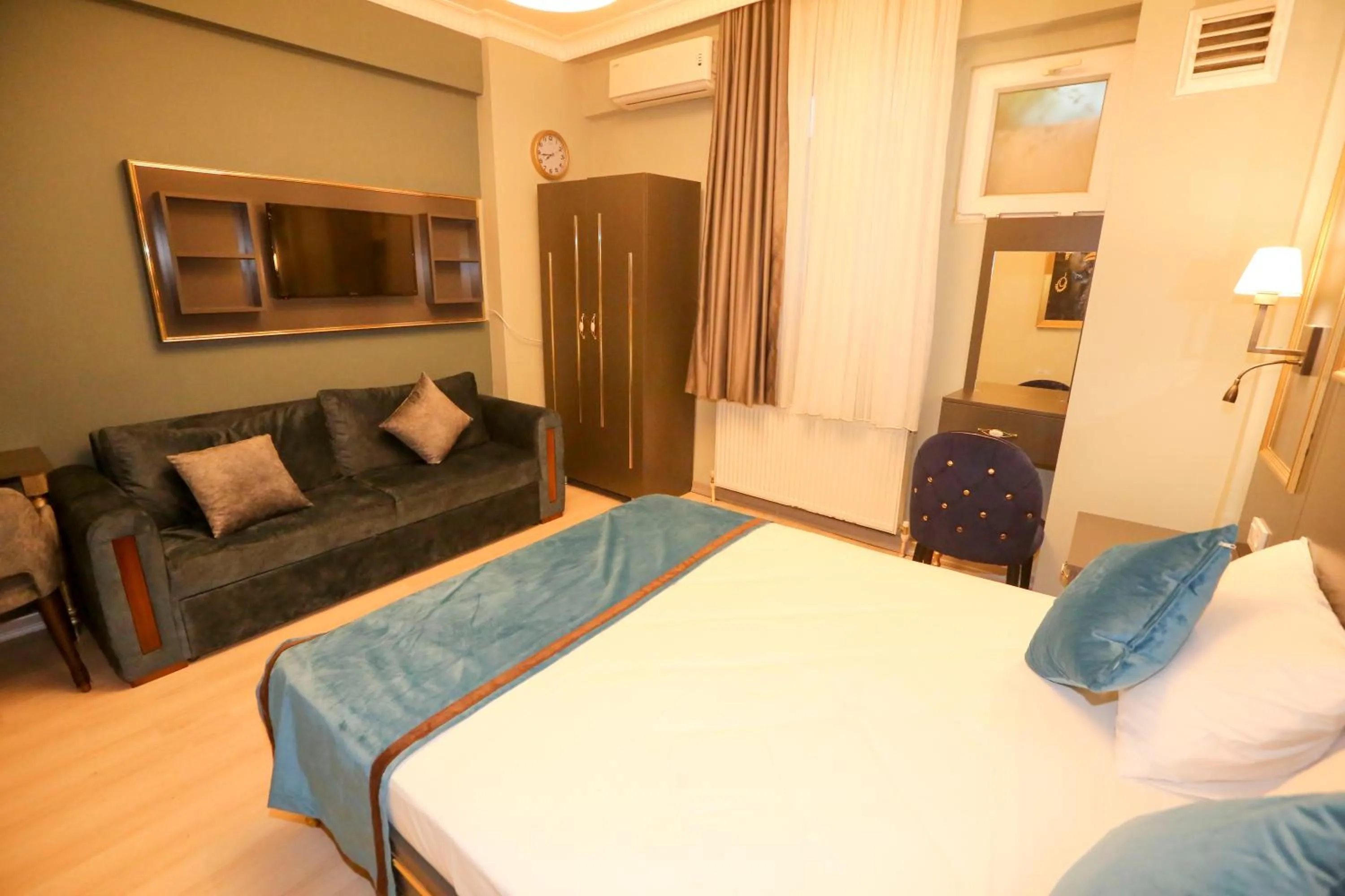 Bed in Grand Moon Hotel Suites