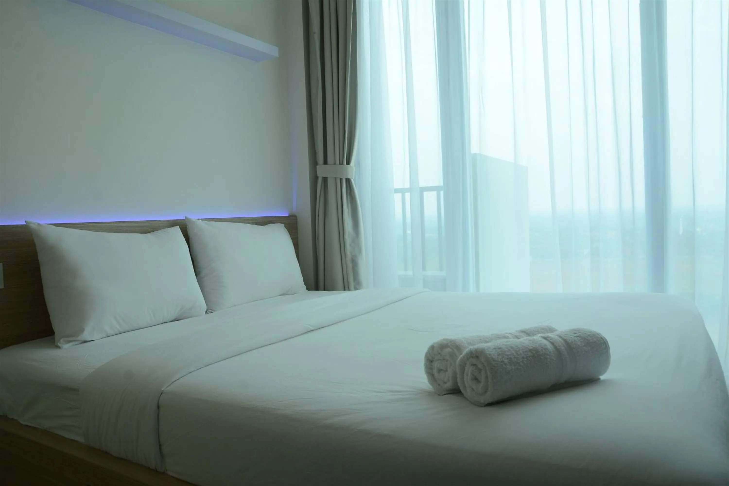 Bed in Brand New Studio Tree Park City BSD Apartment near ICE BSD By Travelio