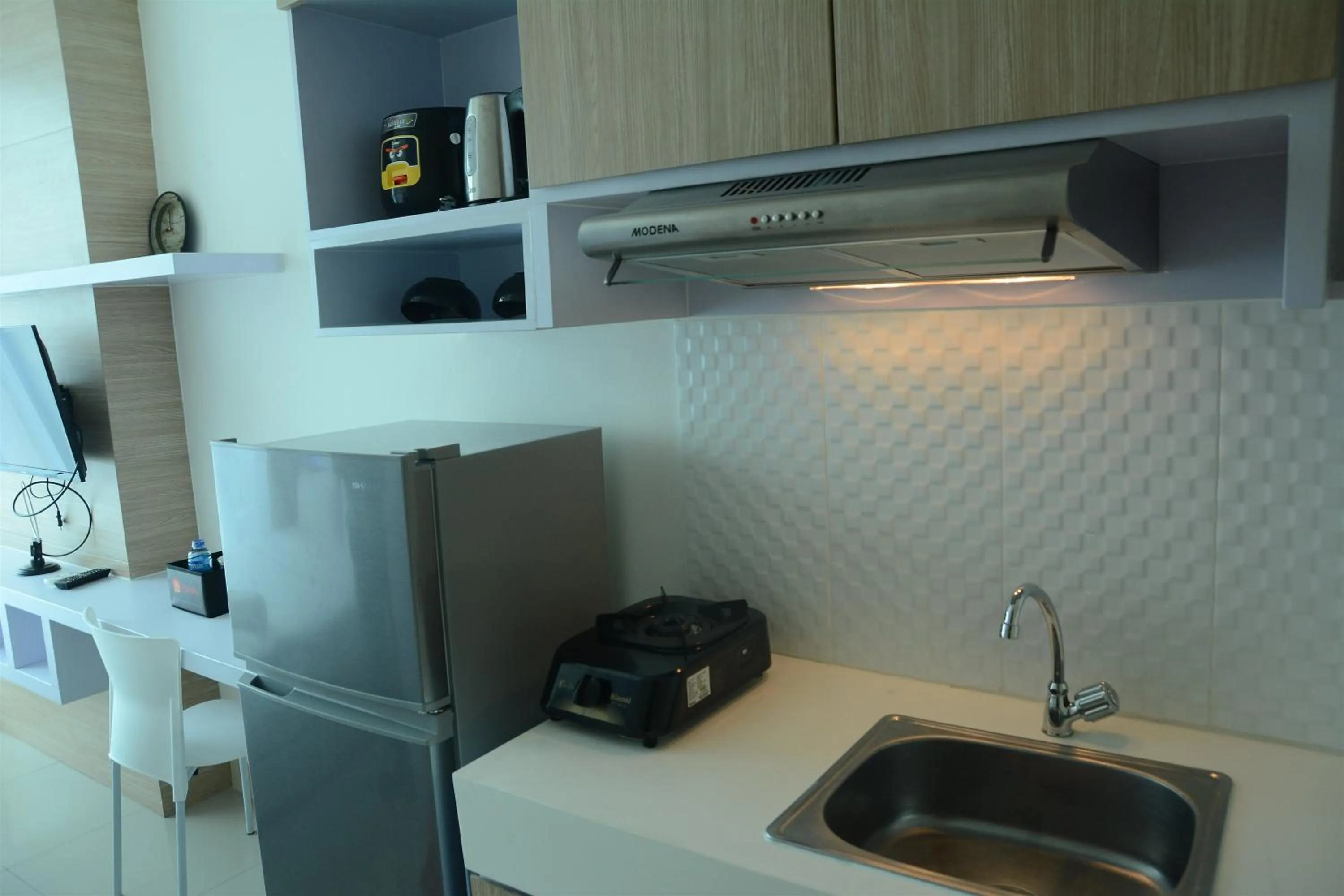 Dining area in Brand New Studio Tree Park City BSD Apartment near ICE BSD By Travelio