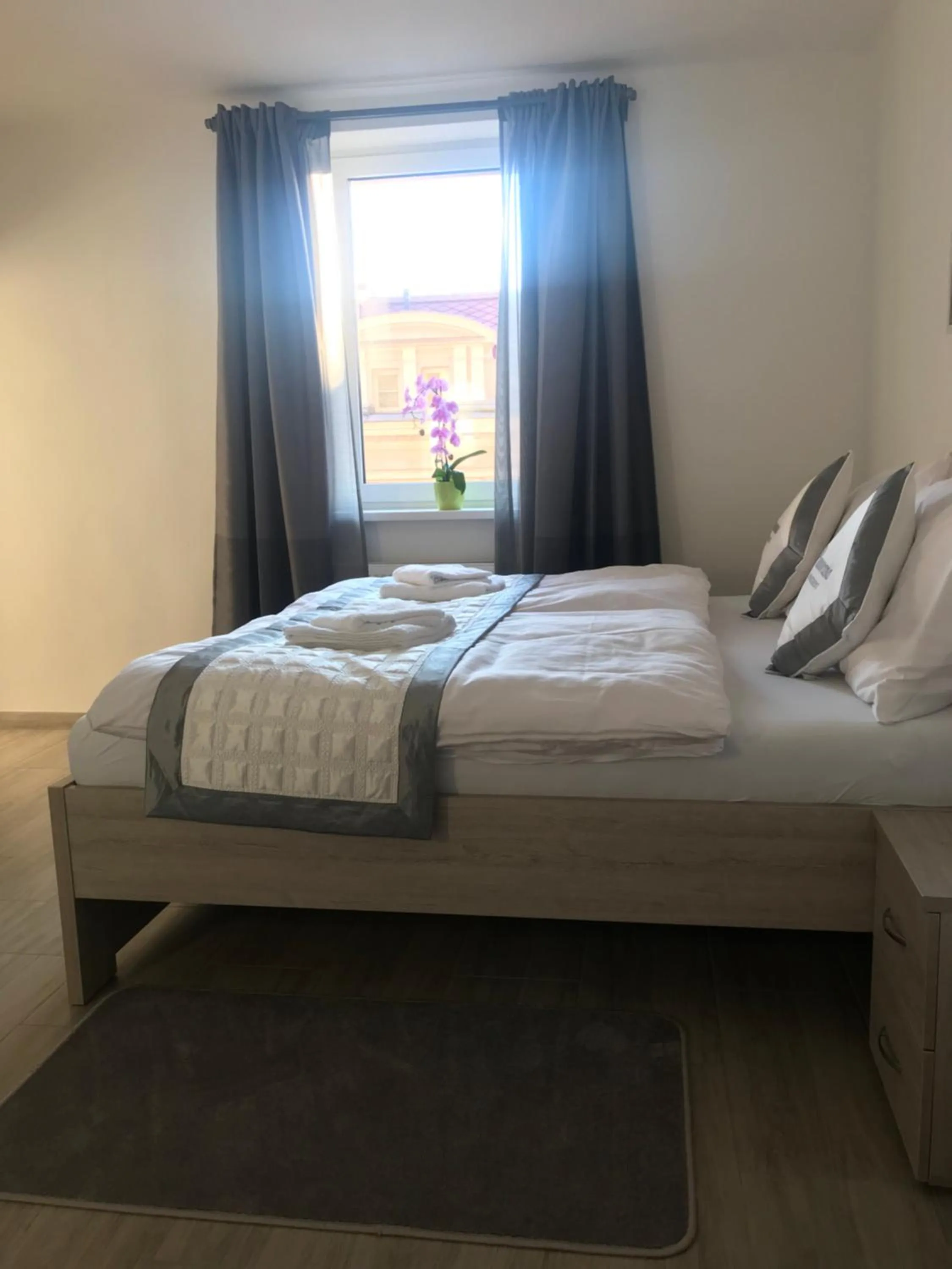 Bed in Panorama Apartments