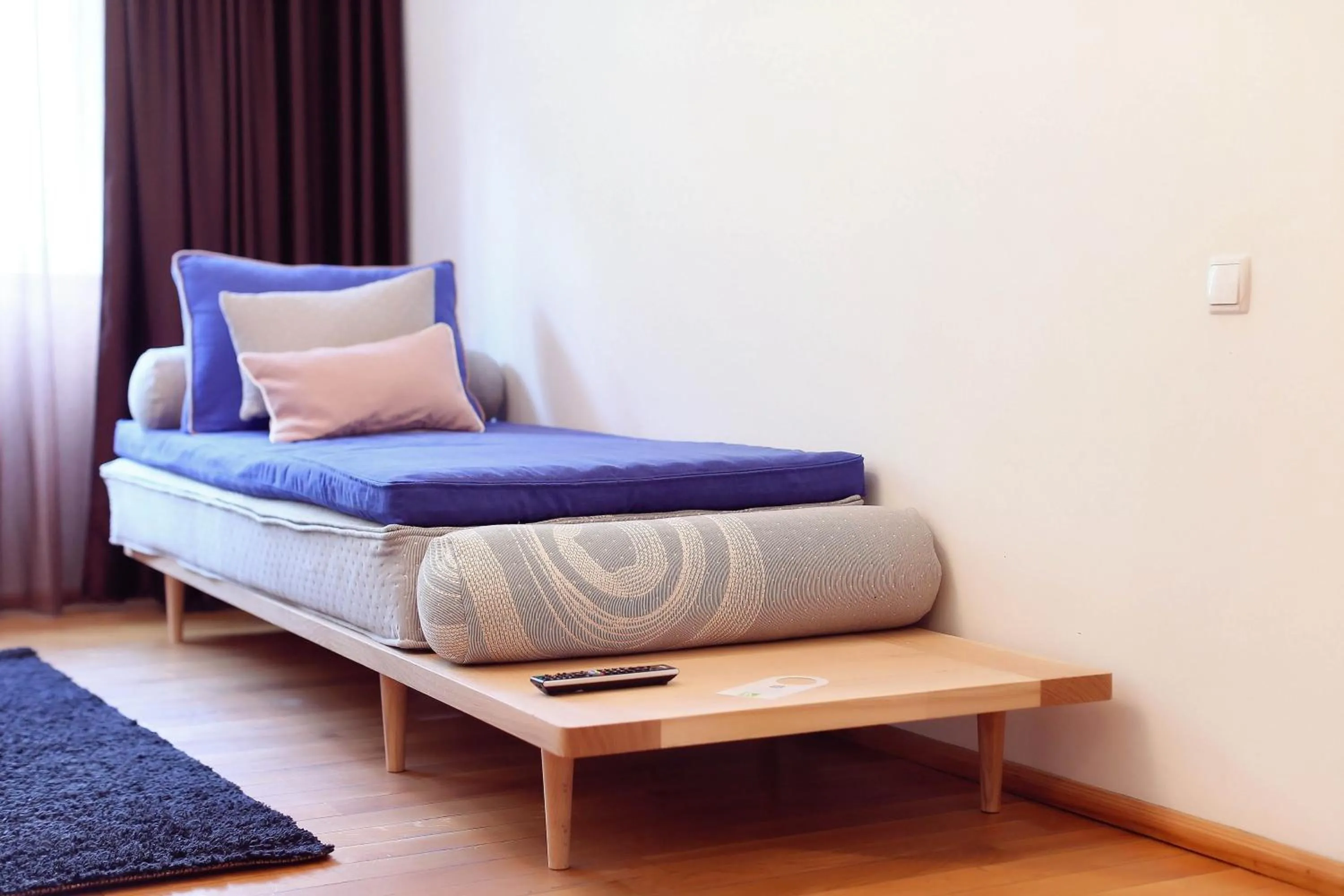 Seating area, Bed in Living In Aparthotel