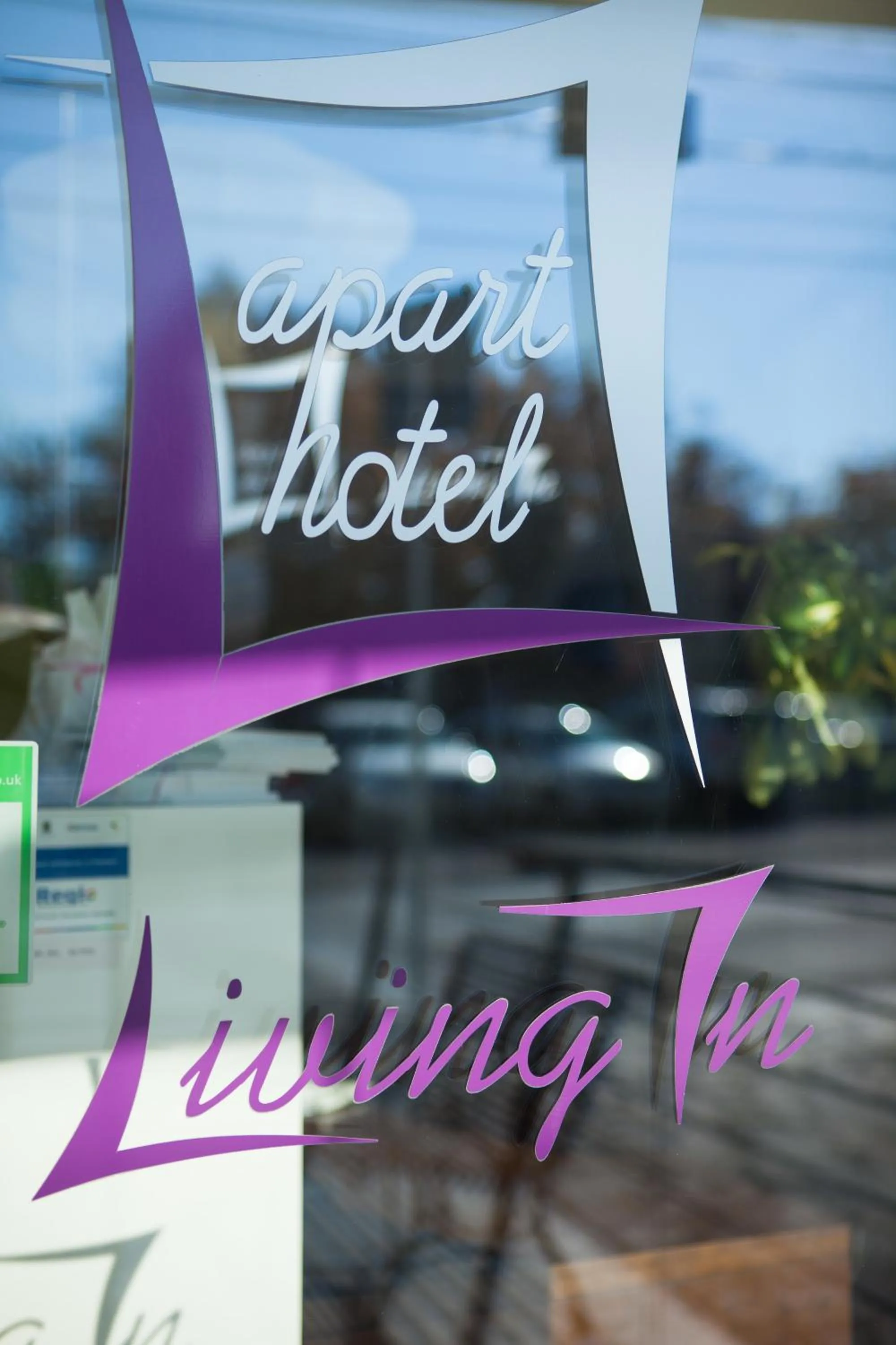 Property logo or sign in Living In Aparthotel