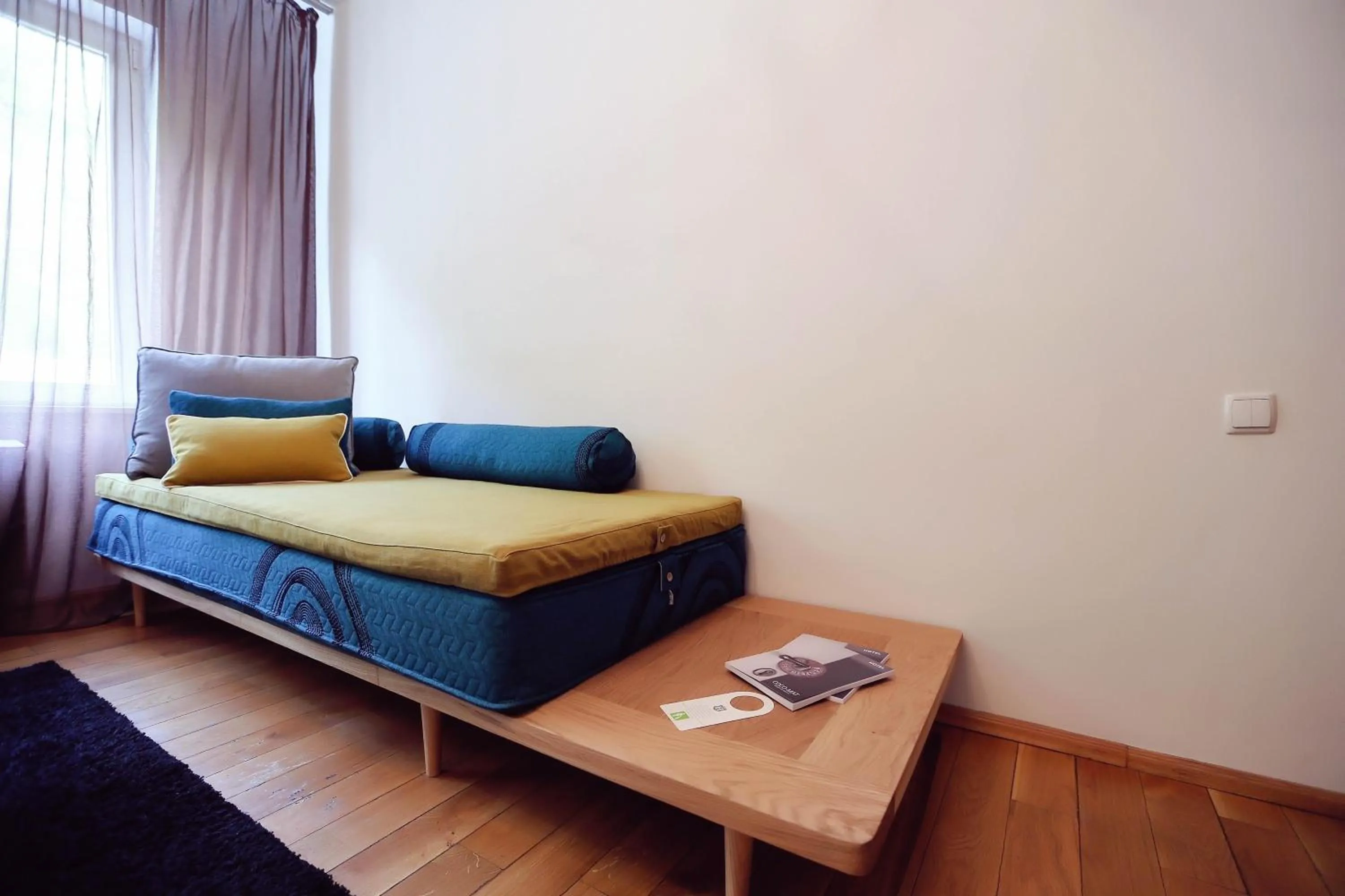 Bed in Living In Aparthotel