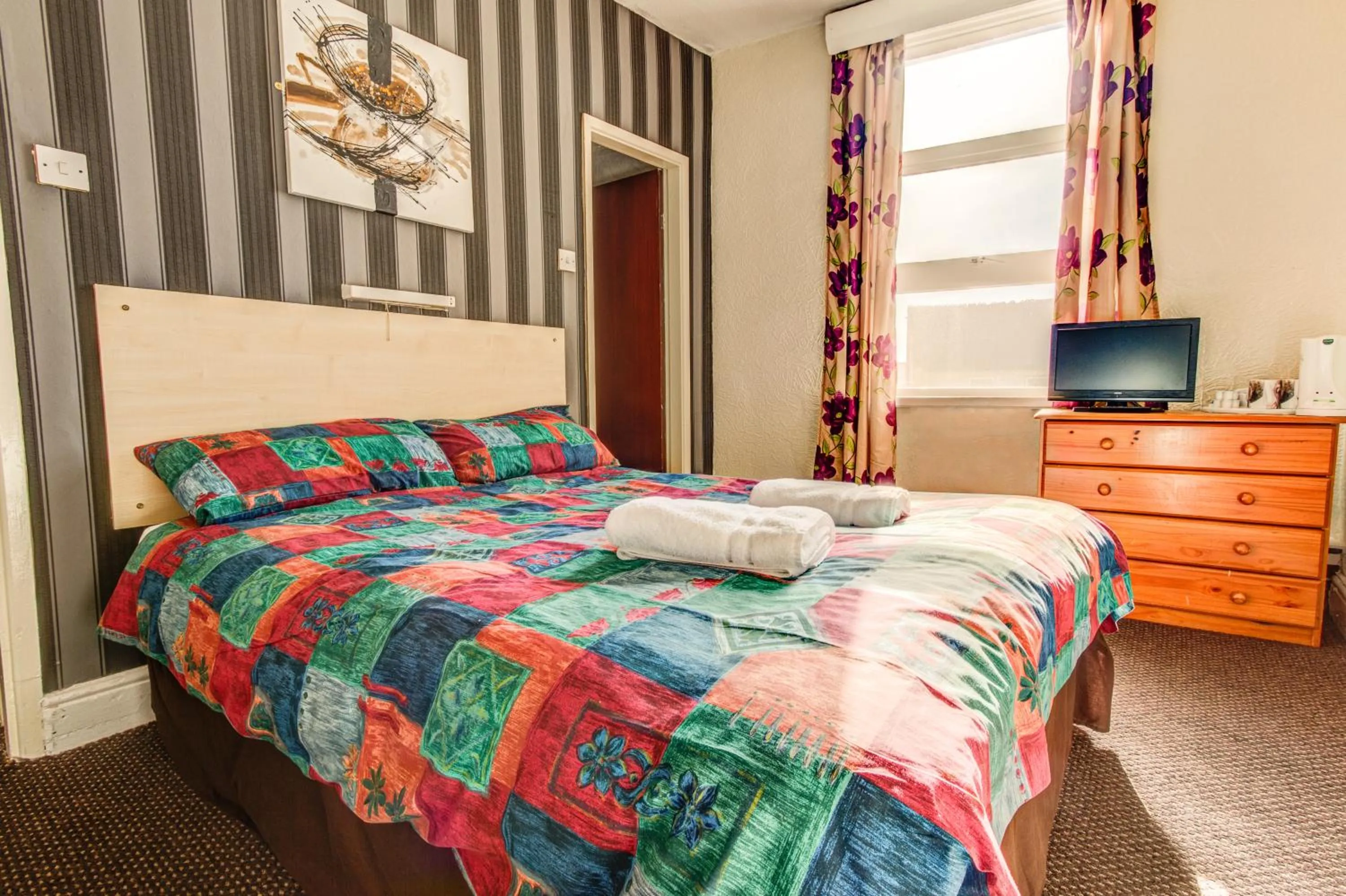 Bed in New Promenade Hotel