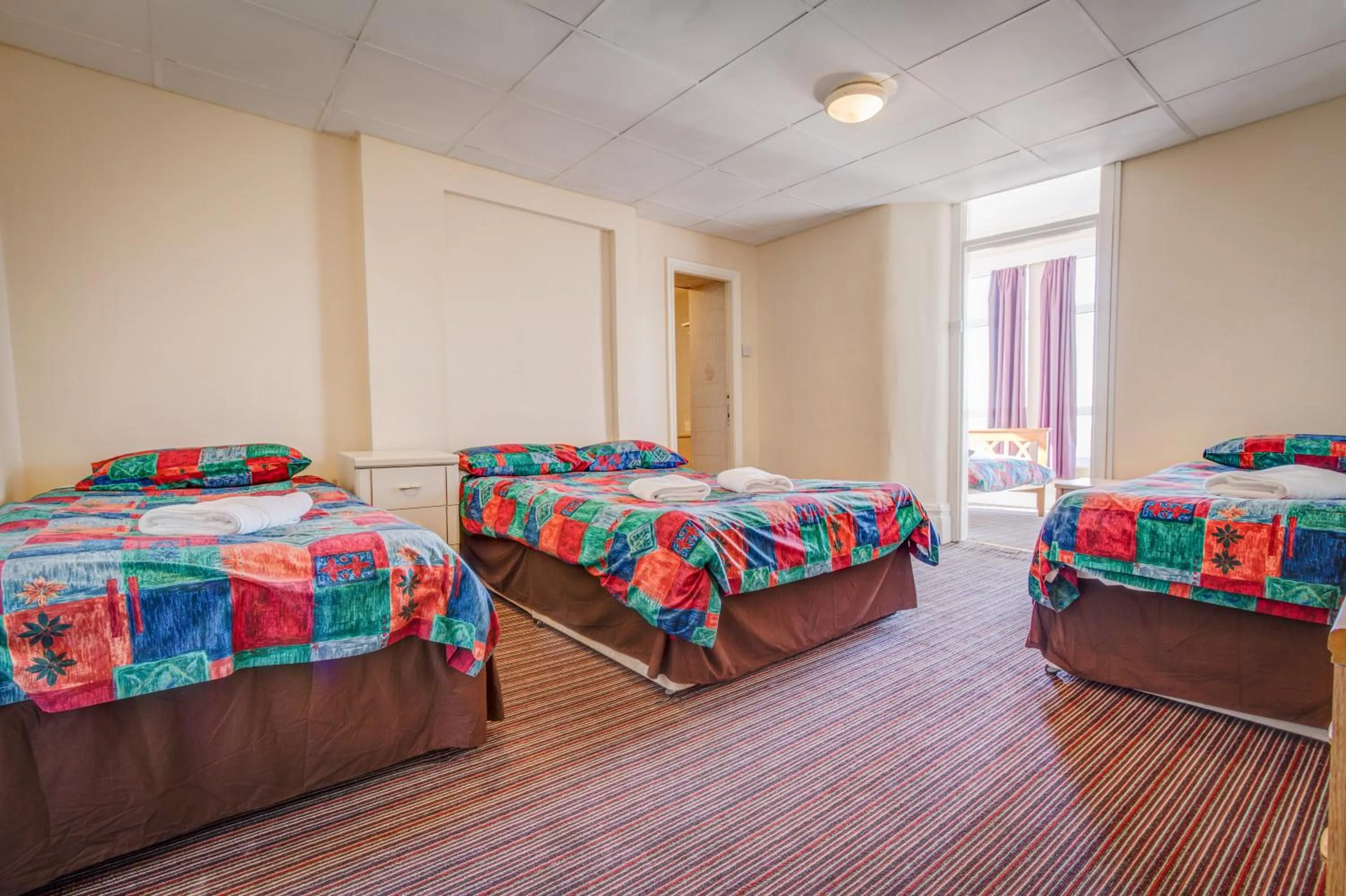 Bed in New Promenade Hotel