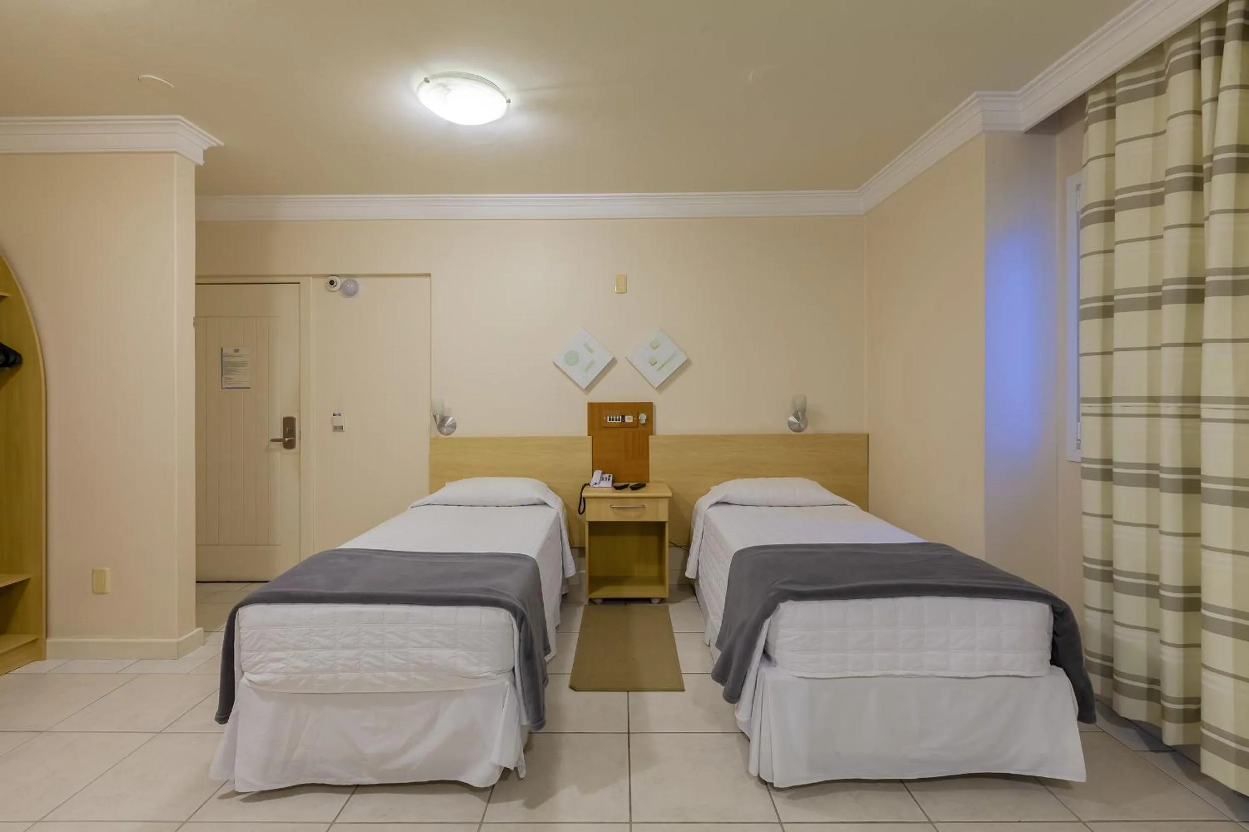 Bedroom, Bed in Tri Hotel Executive Criciúma