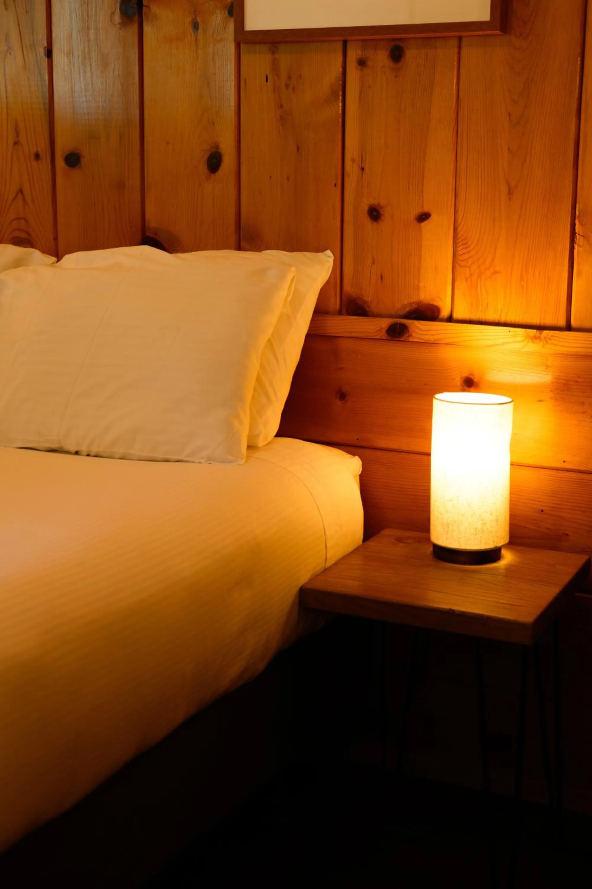 Bed in Lake Front Cabins