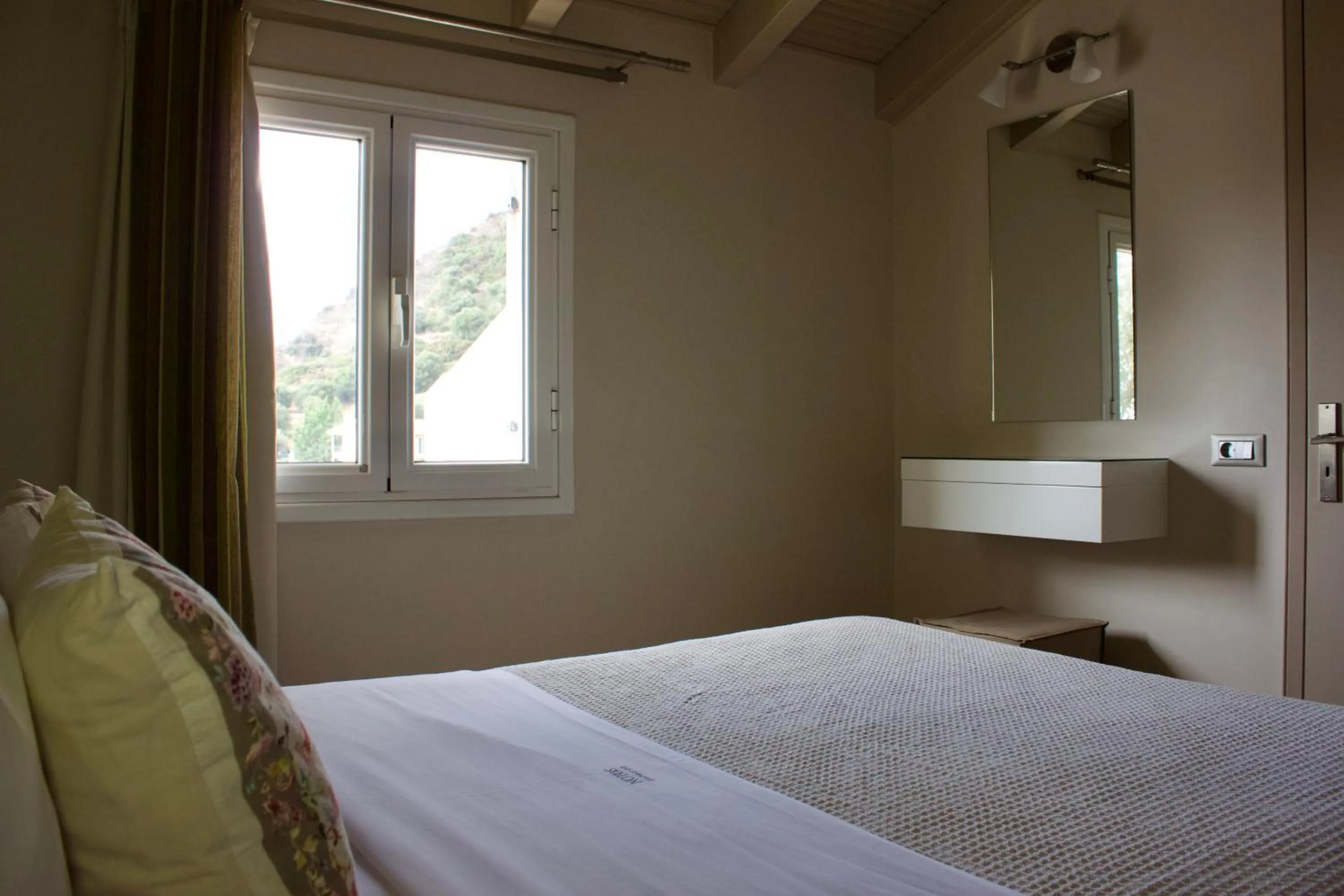 Bed in Notos Luxury Studios