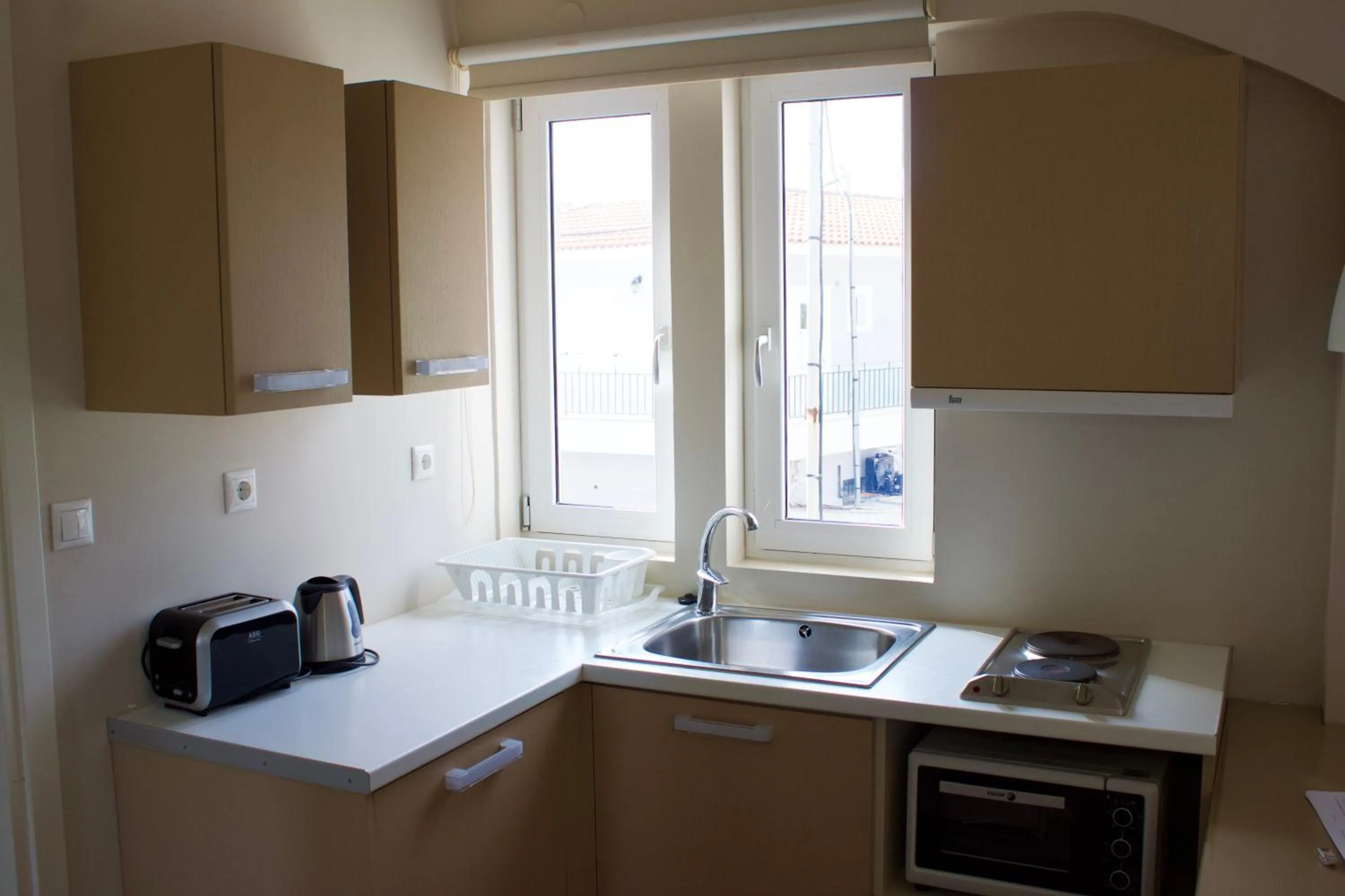 Kitchen or kitchenette in Notos Luxury Studios