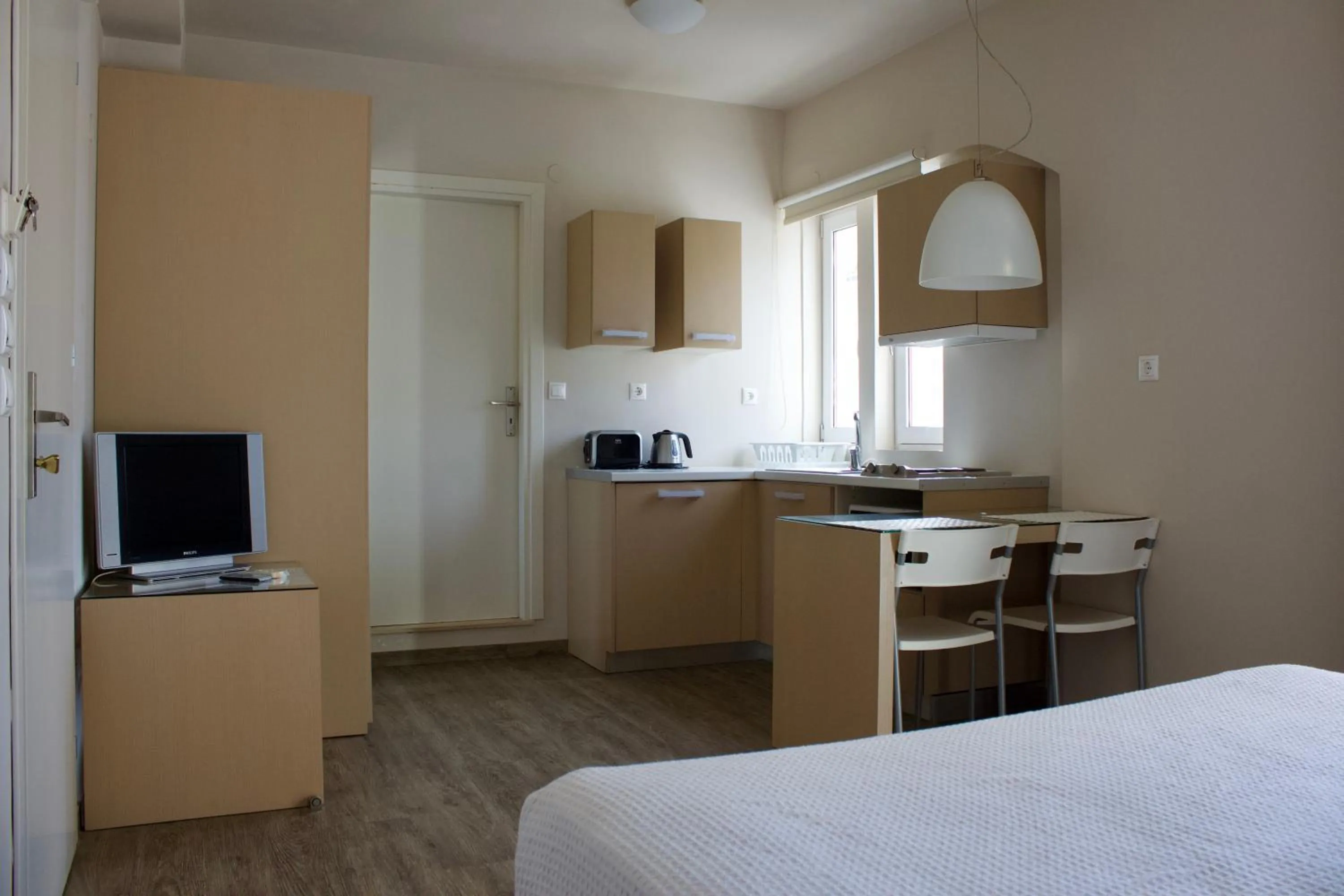 Kitchen or kitchenette, Bed in Notos Luxury Studios