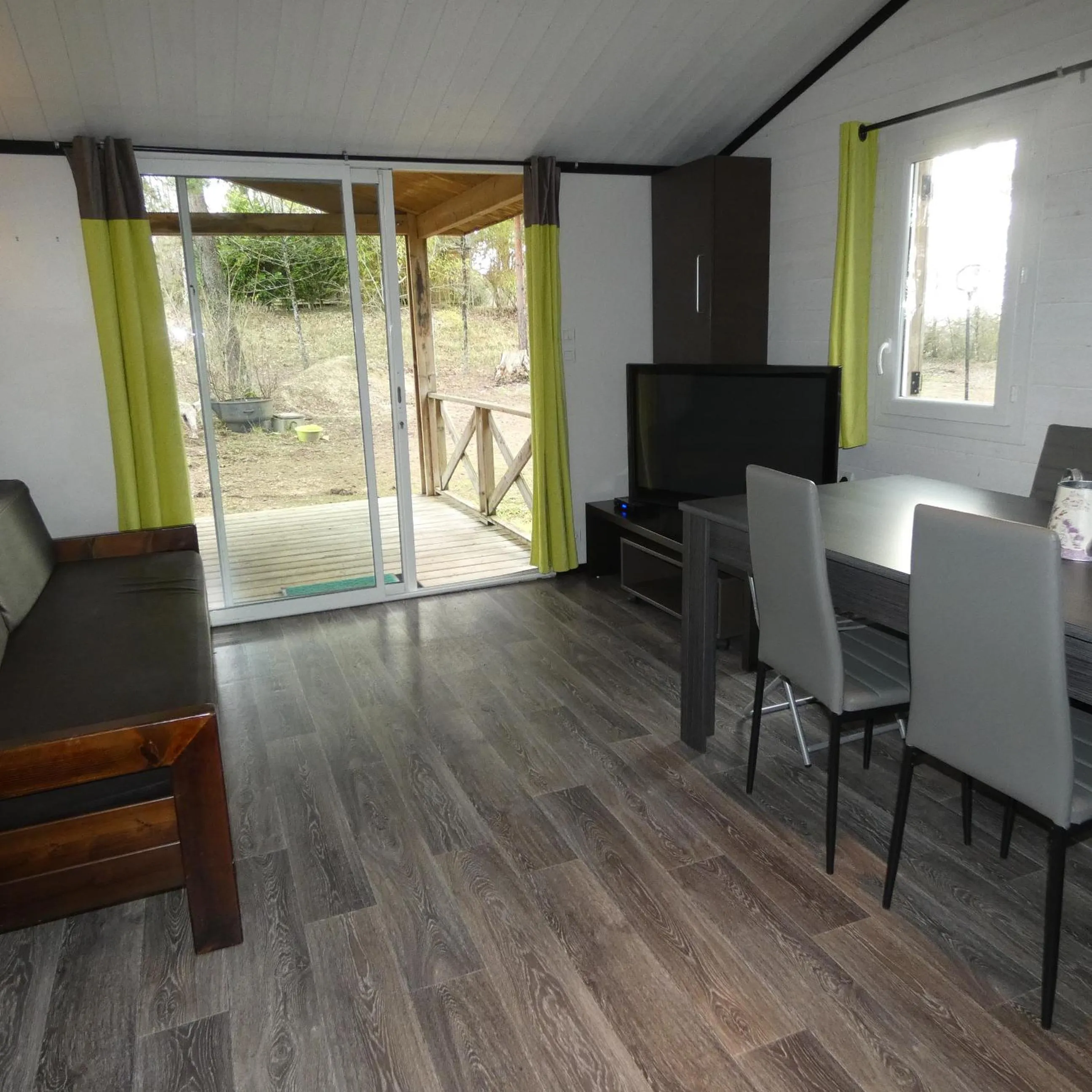 Communal lounge/ TV room in Les Chalets d'Argentouleau