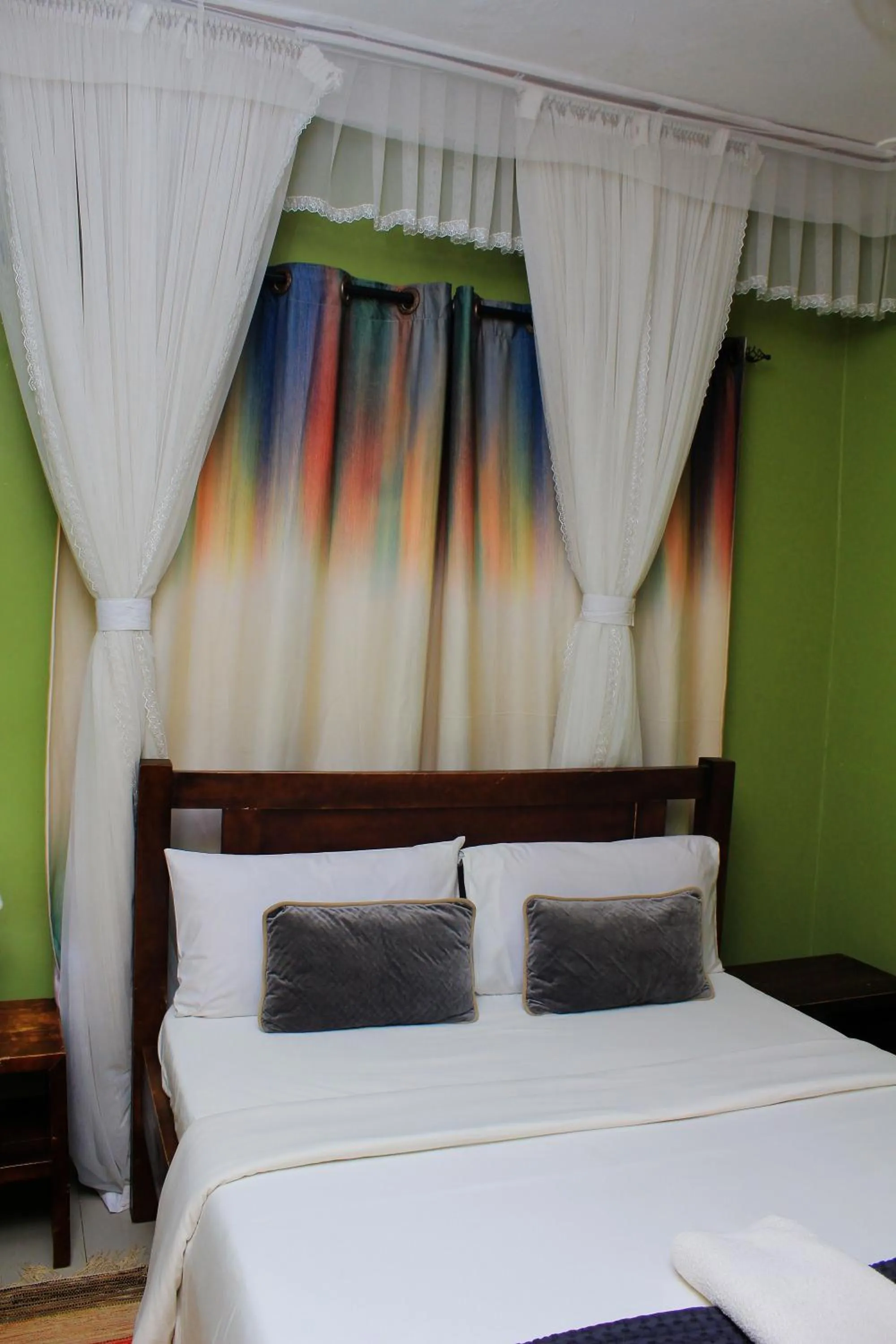 Bed in MAMIKKI Hotel Apartments