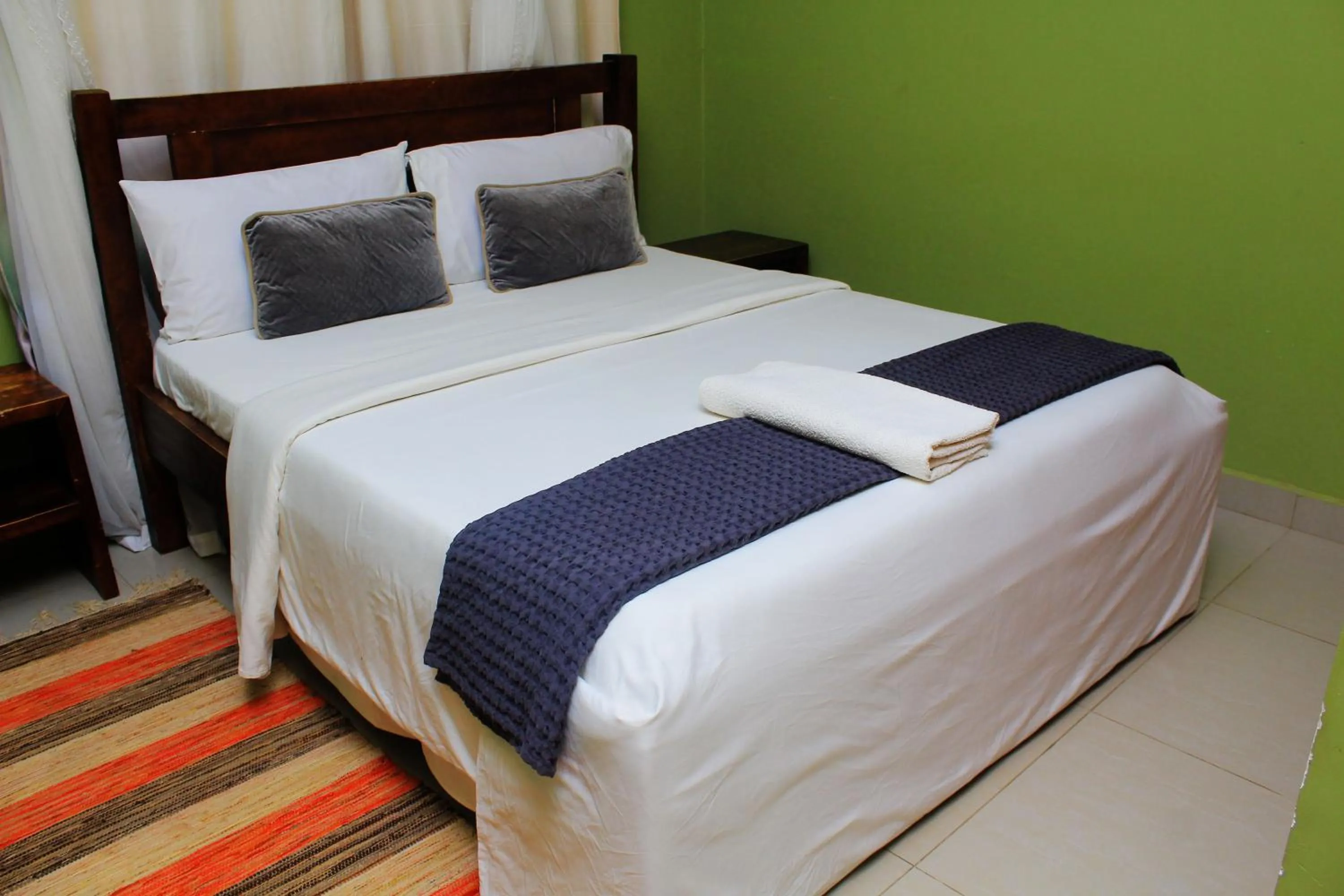 Bed in MAMIKKI Hotel Apartments