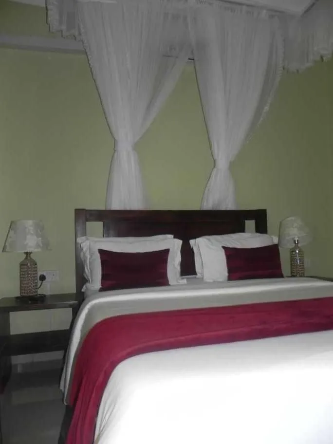 Bed in MAMIKKI Hotel Apartments