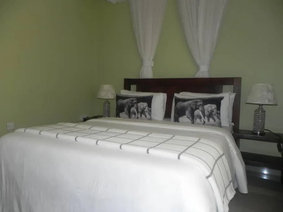 Bed in MAMIKKI Hotel Apartments