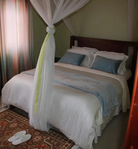 Bed in MAMIKKI Hotel Apartments