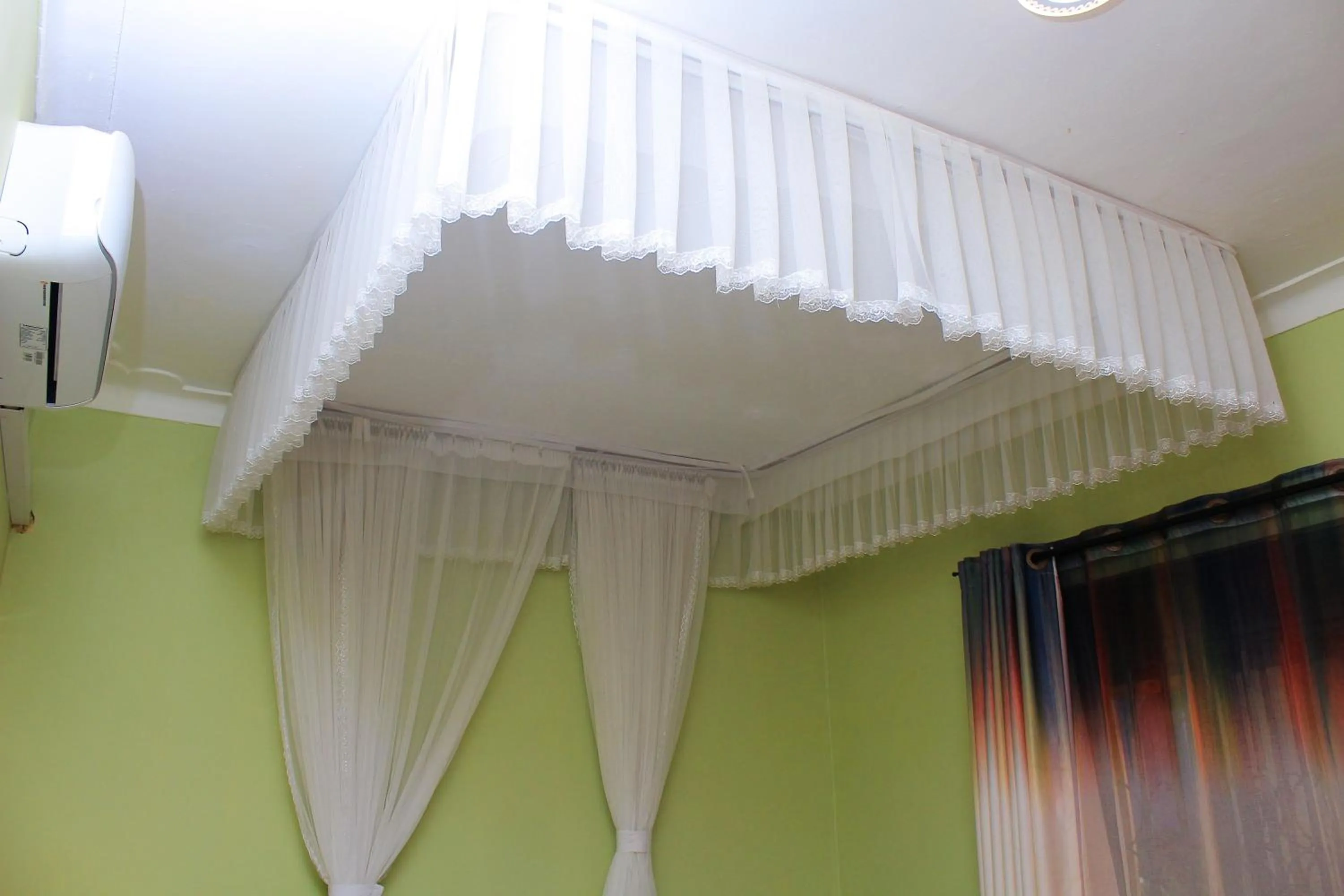 Bed in MAMIKKI Hotel Apartments